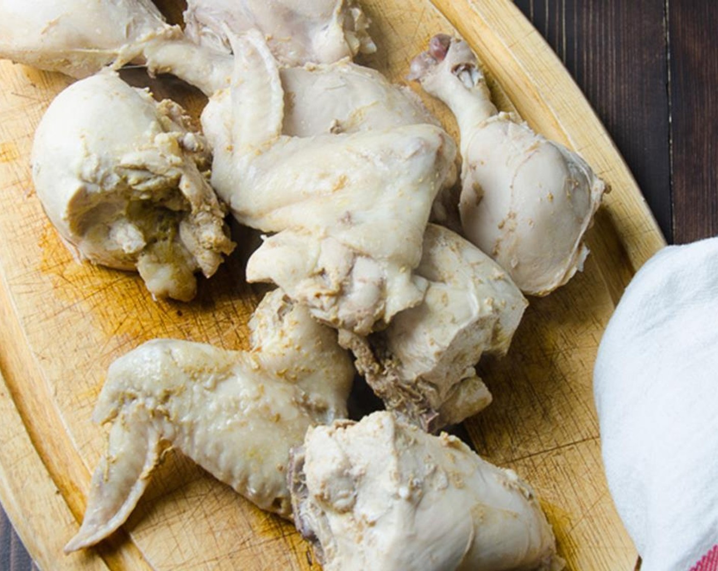 step 5 Using tongs, transfer the chicken to a cutting board to cool.