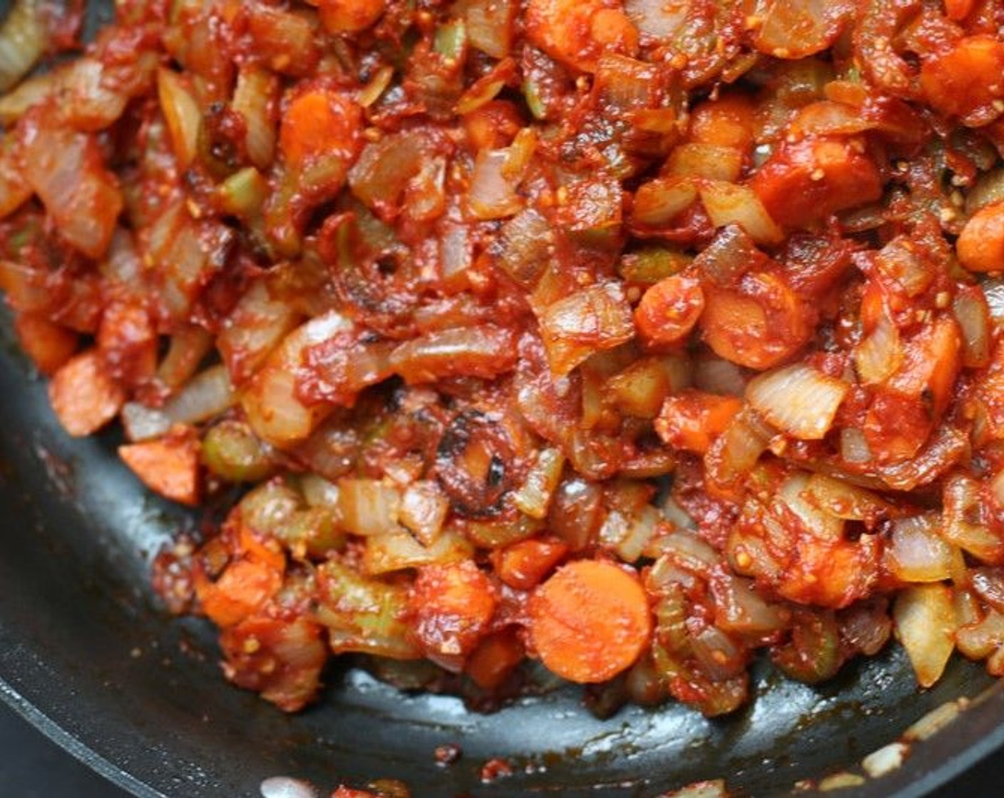 step 7 Add Tomato Paste (1/2 cup) to the softened vegetables and stir frequently for 2 to 3 minutes.