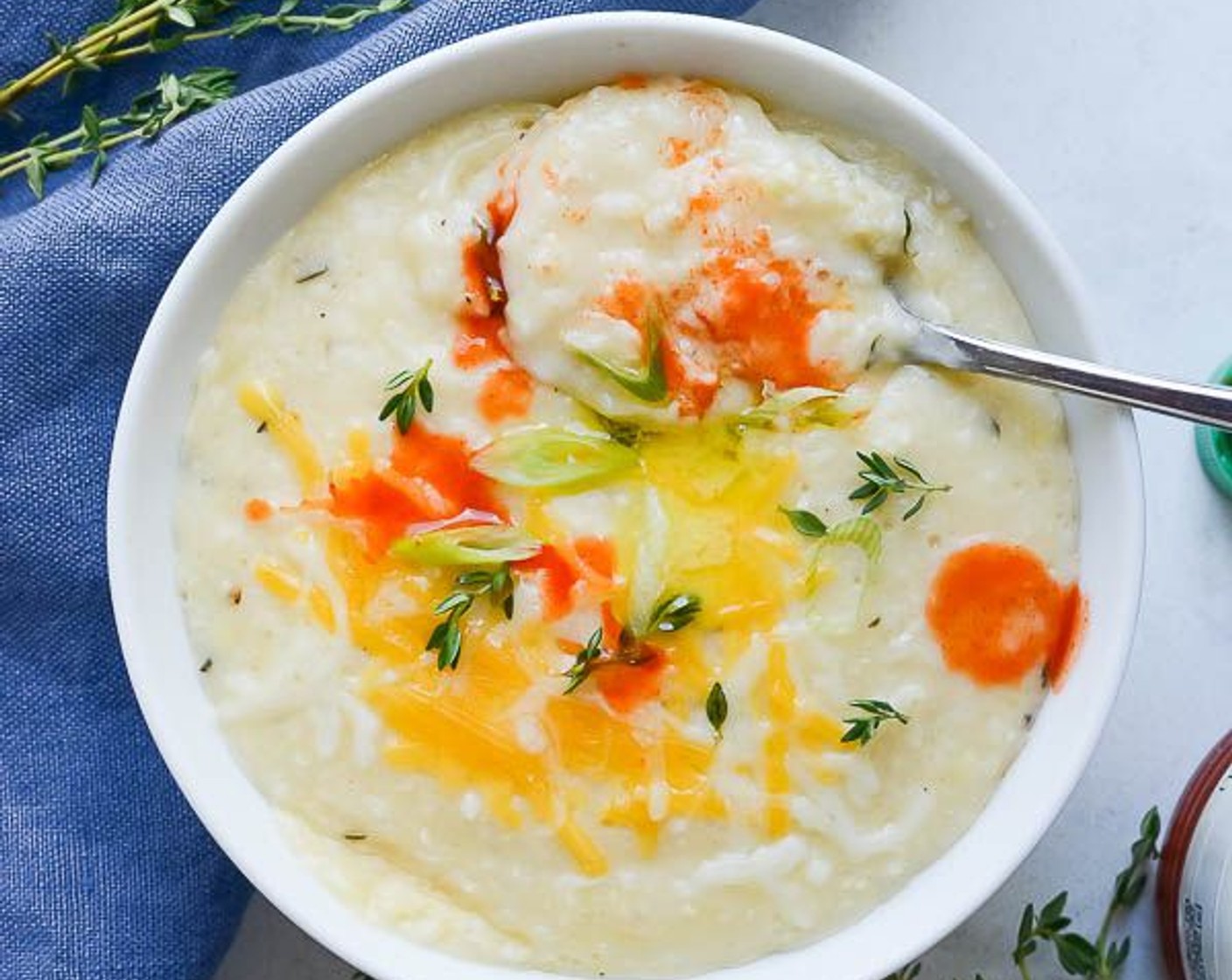 step 10 At this point, you can hold the grits covered in a pot until you're ready to eat them (they will continue to thicken as they cool). Rewarm them to serve, garnished with additional cheese and hot sauce if desired.