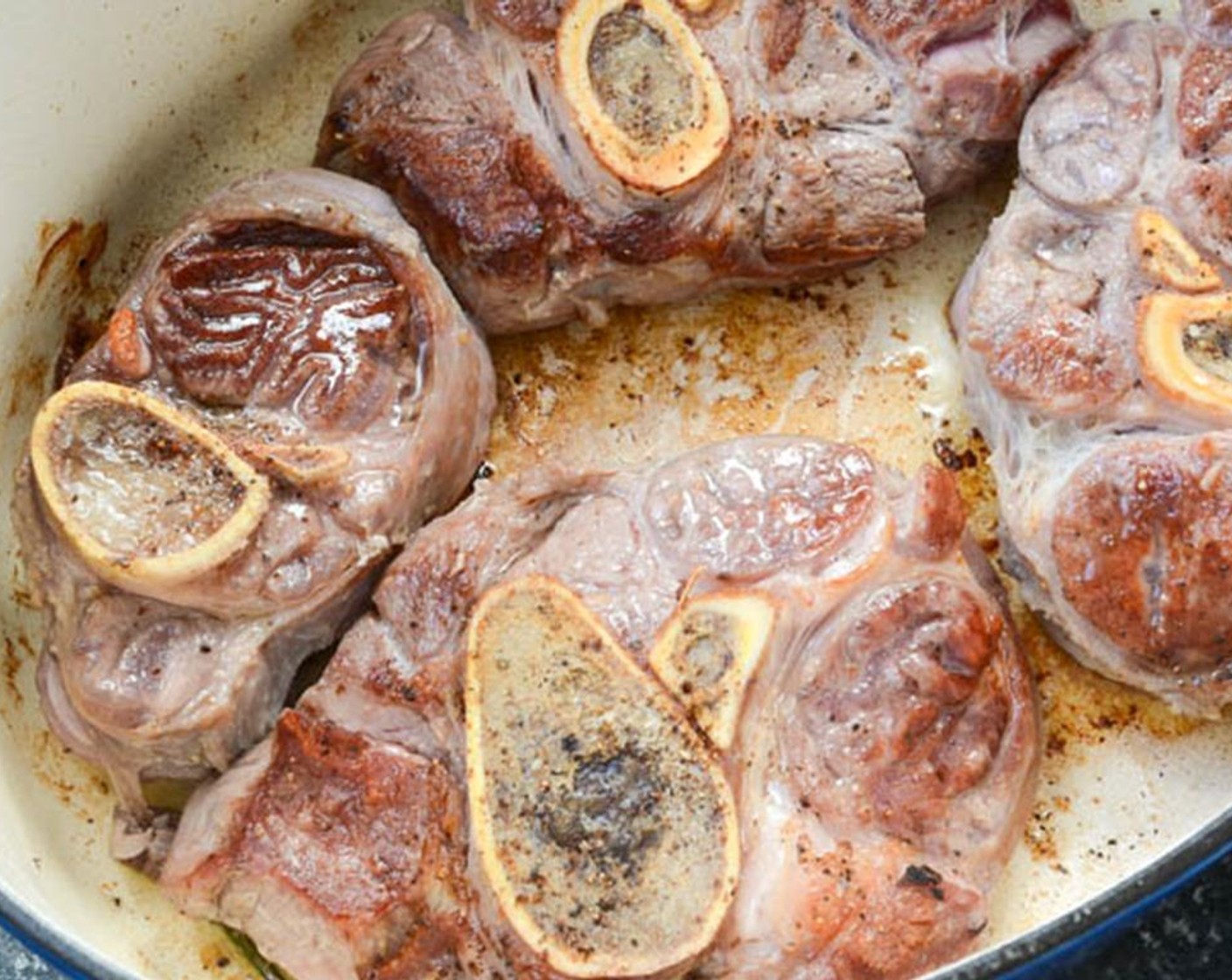 step 3 In a large dutch oven, heat the Olive Oil (1 Tbsp) medium to medium-high heat. Place the veal in the dutch oven and brown on each side. Transfer the veal to a plate and set aside.