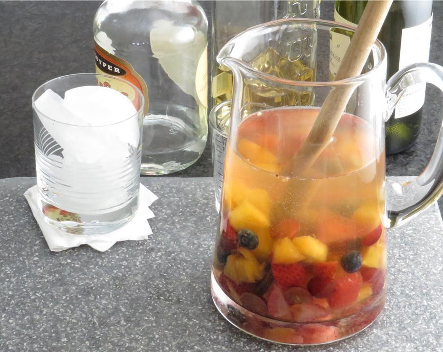 step 3 Combine the fruit mix with Triple Sec (1/2 cup), White Rum (1 cup) and Dry White Wine (3 cups) together in a pitcher. Chill for several hours. Serve as is, or with a splash of Soda Water (to taste) if desired.