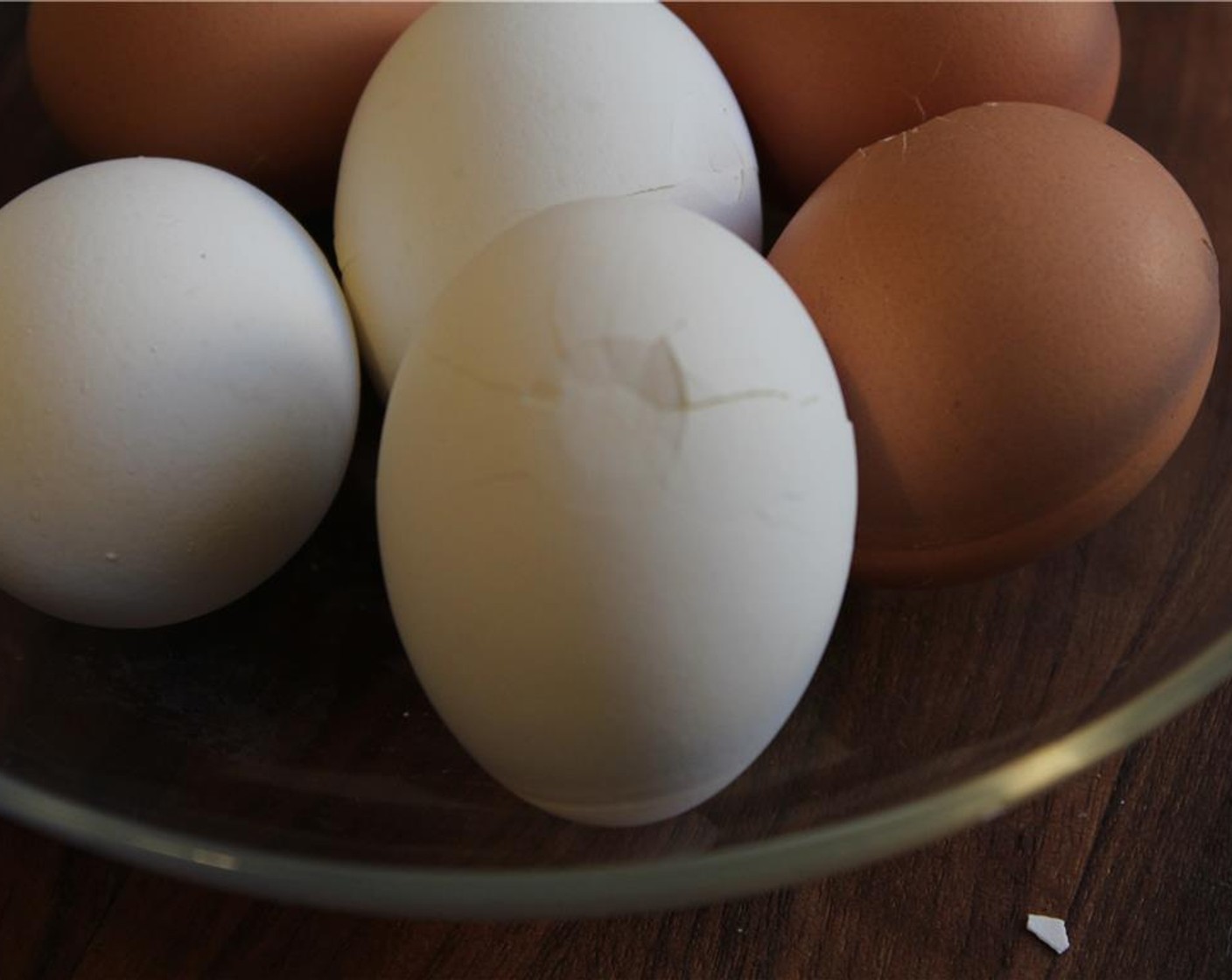 step 5 Tap each eggs with the back of a spoon to crack the shell.  Do not peel the shell as the crack will allow the tea mixture to seep in and create the notable crackling pattern.