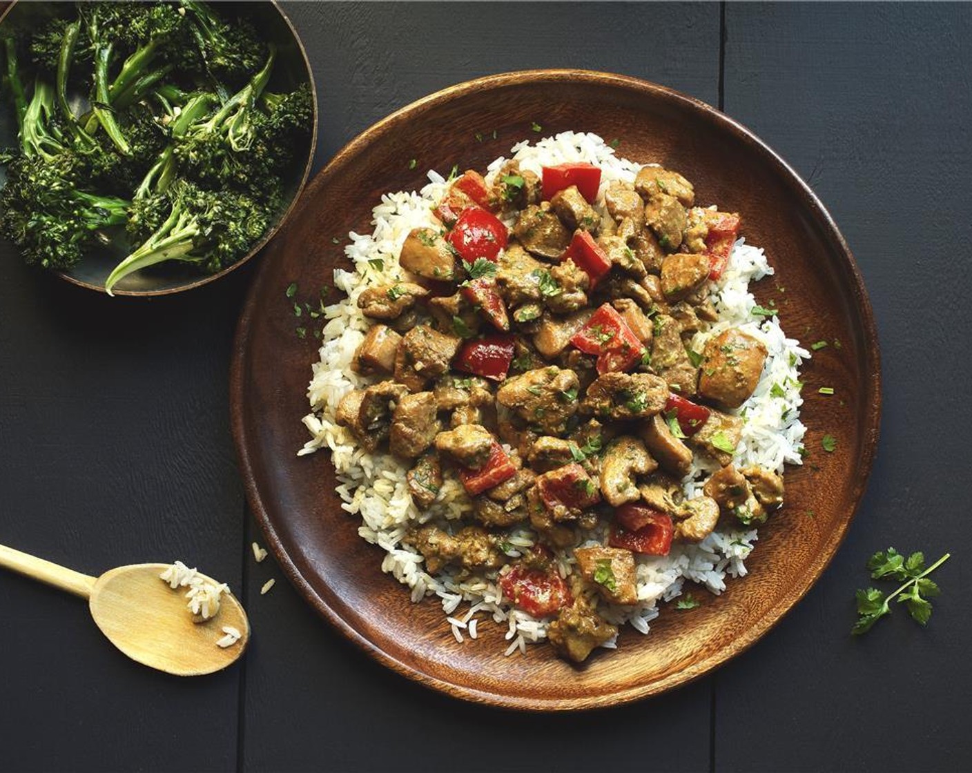 step 12 In the center of two plates, place the jasmine rice. Add the lemongrass chicken over the rice and place the broccolini on the side. Garnish with Fresh Cilantro (1/2 cup)