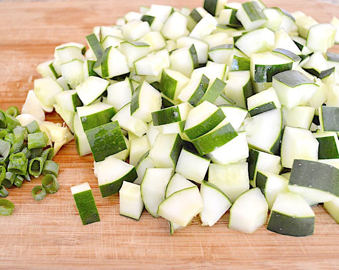 step 1 First, reserve 1/3 cup of the Cucumbers (2) and set it aside for garnish.