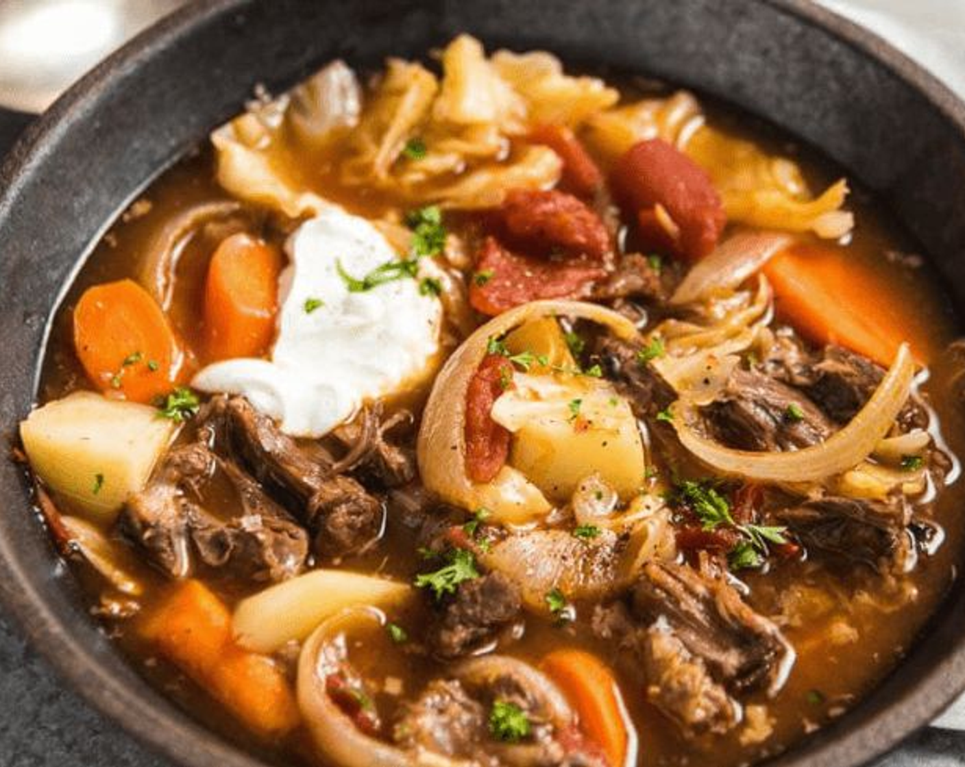 step 9 Transfer the soup into large bowls, garnish with Sour Cream (to taste) and serve warm as a main.