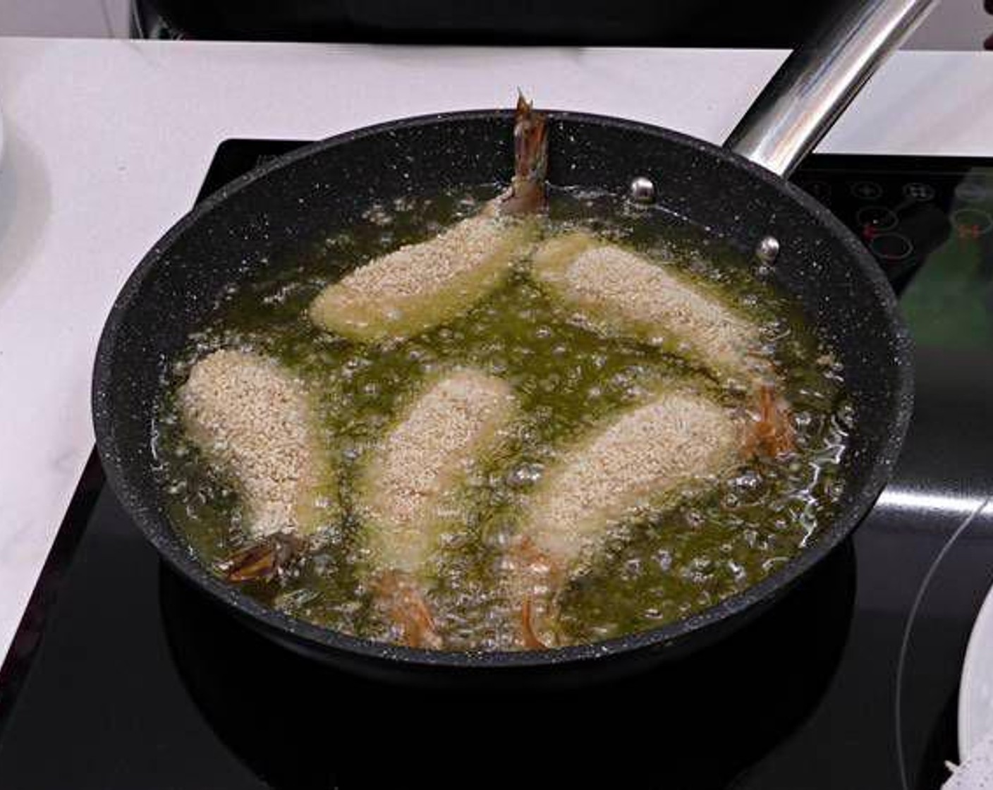 step 4 In one bowl place add a beaten Eggland's Best Classic Eggs (to taste) and in another bowl add Breadcrumbs (to taste) seasoned with Salt (to taste). Dip the scampi in egg, and then breadcrumbs, then add to the pan with hot Olive Oil (as needed) on medium-high heat to fry them.