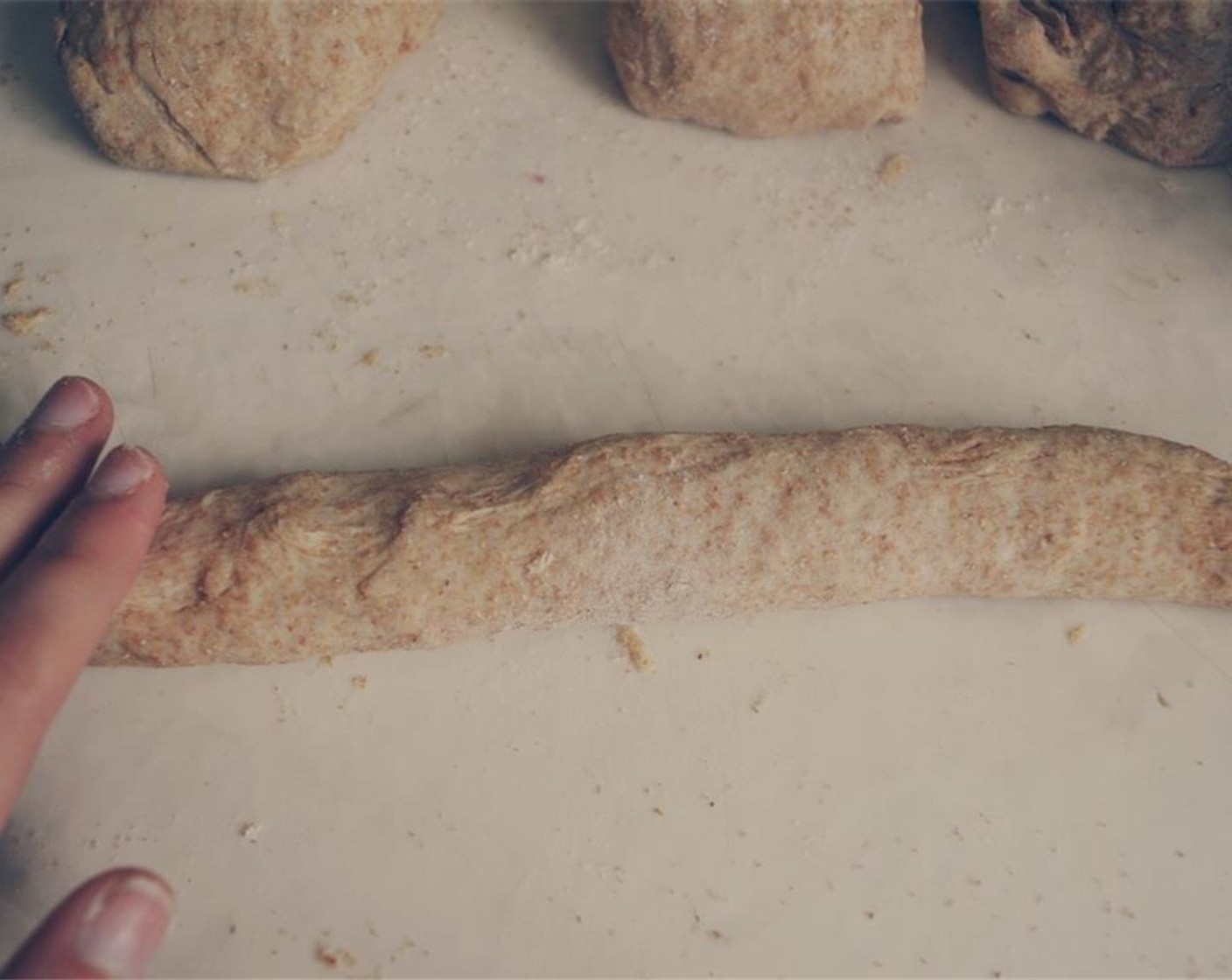 step 7 Now use your palms to roll the dough into a long rope, about 8-10 inches long.