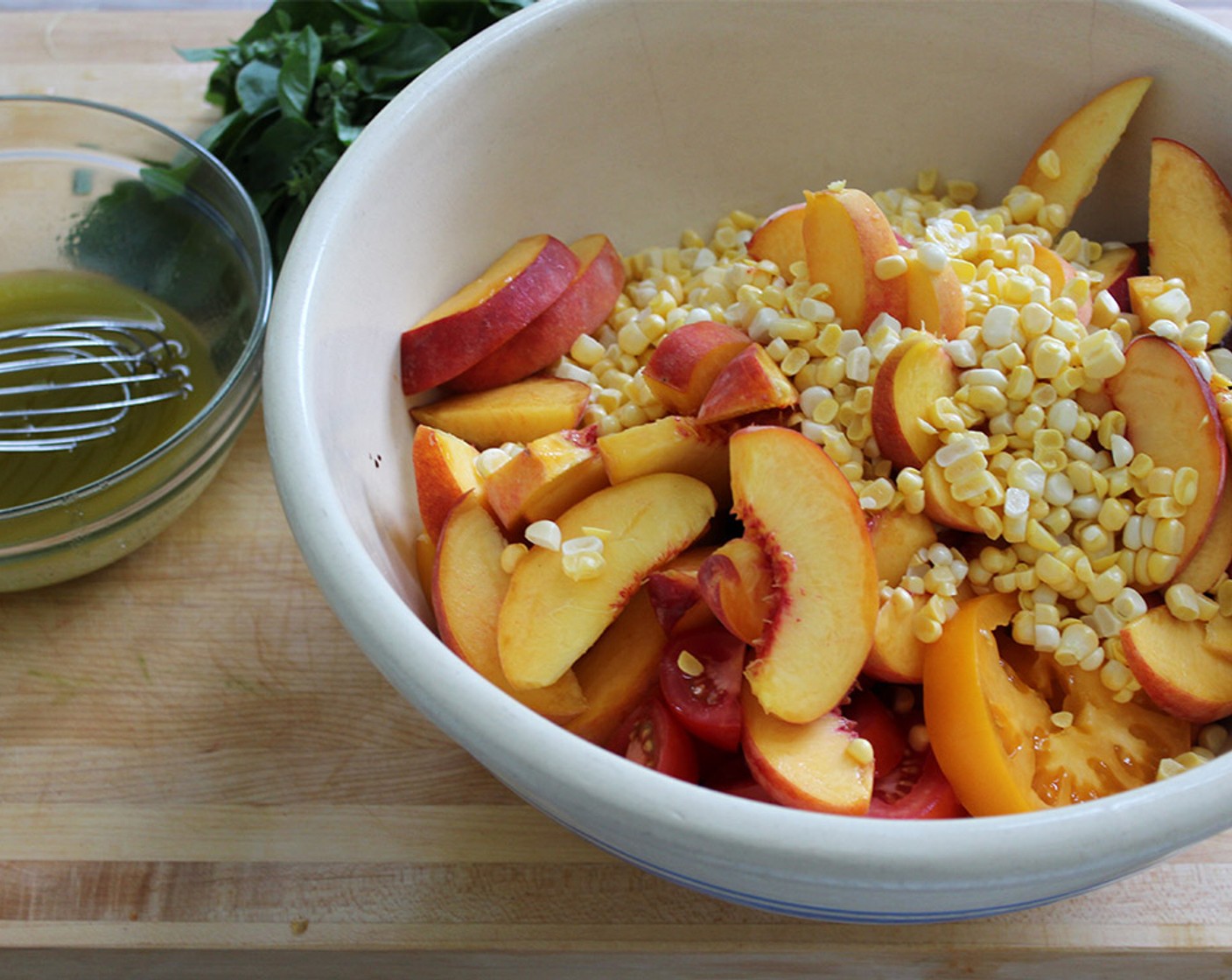 step 1 Combine the Tomatoes (7 1/2 cups), Peaches (3), Corn (3 ears) and Fresh Basil (1/2 cup) in a large bowl.