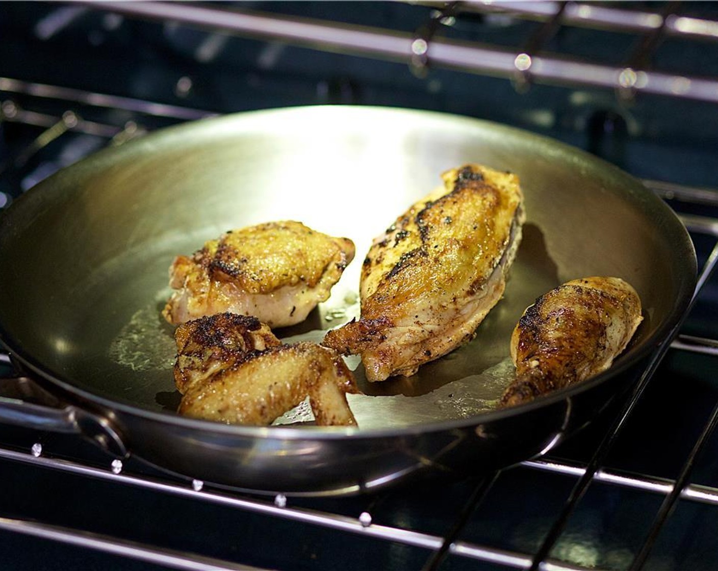 step 14 Add chicken broth and the remaining Garlic (4 cloves) to the pan and place in the oven. Roast for thirty minutes, or until cooked through.