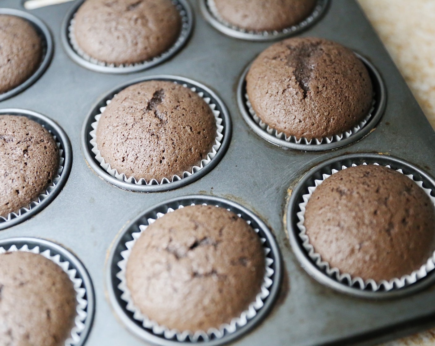 step 7 Remove the cupcakes from the oven and allow to cool completely. While the cake is cooling, make the frosting.