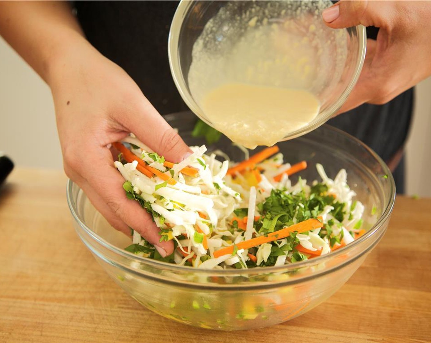 step 16 Pour the miso tahini dressing over the cabbage mixture and toss well. Slice the ahi into approximately twenty equally sized pieces, revealing the beautiful rare interior of the fish.