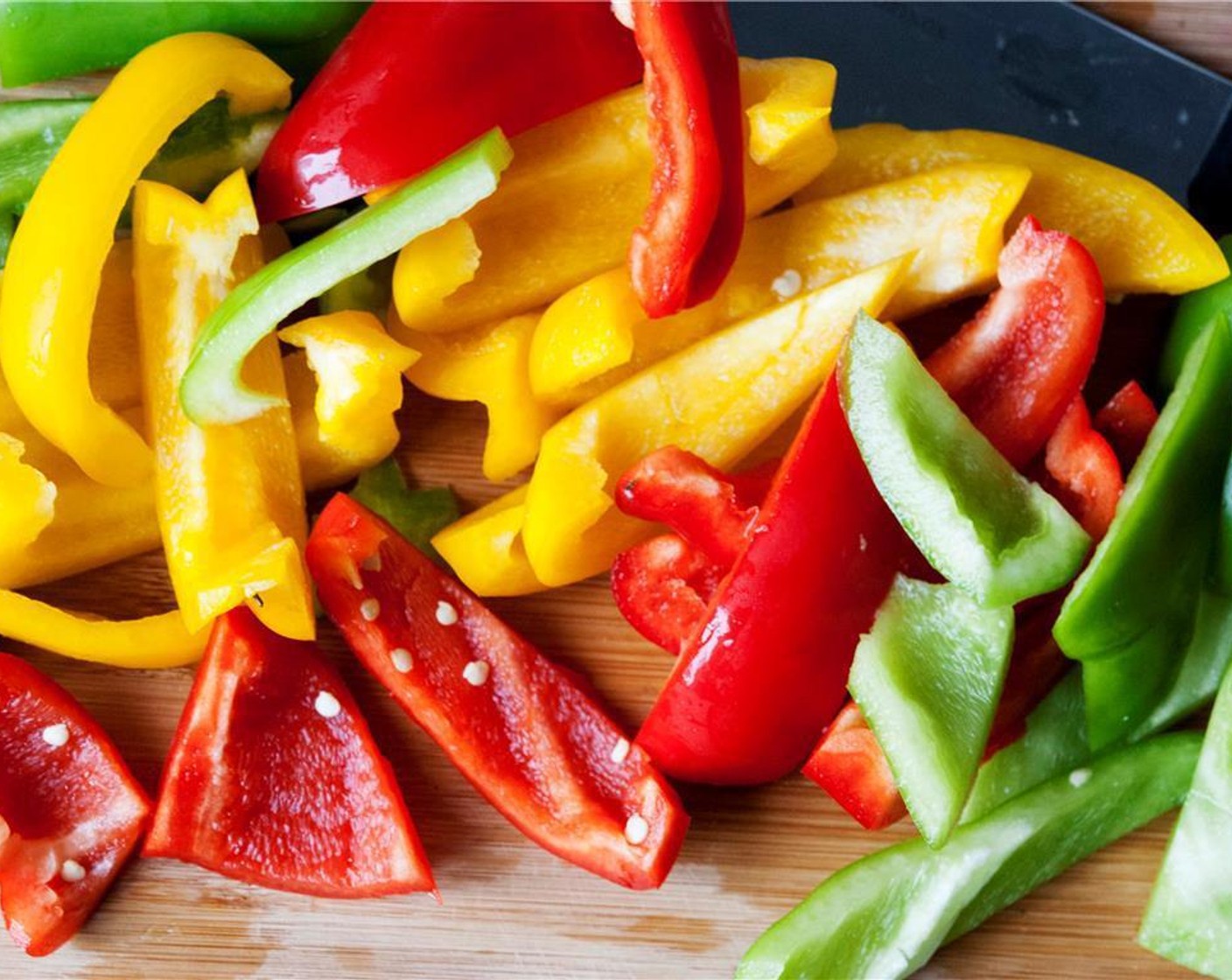 step 3 Wash and slice the Green Bell Peppers (2), Red Bell Peppers (2), and Yellow Bell Peppers (2).