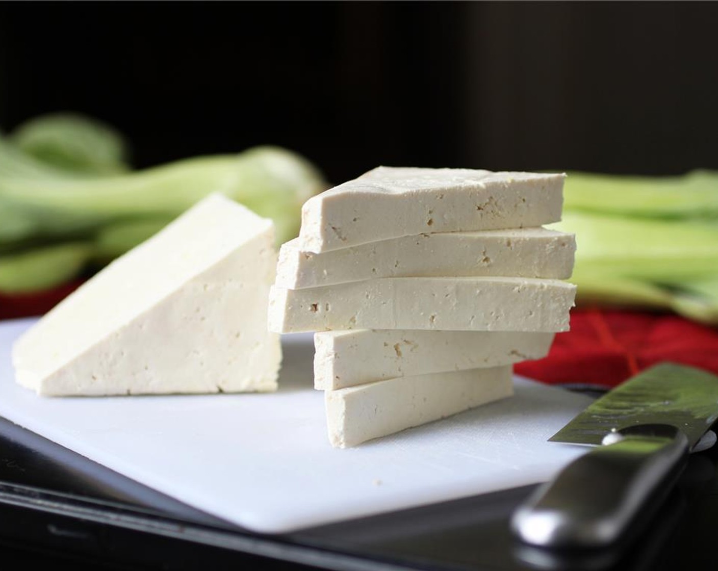 step 1 Start by pressing the water out of the Firm Tofu (3/4 pckg)-wrap the tofu in a towel or paper towel, and set something heavy (like a cookbook) on top.