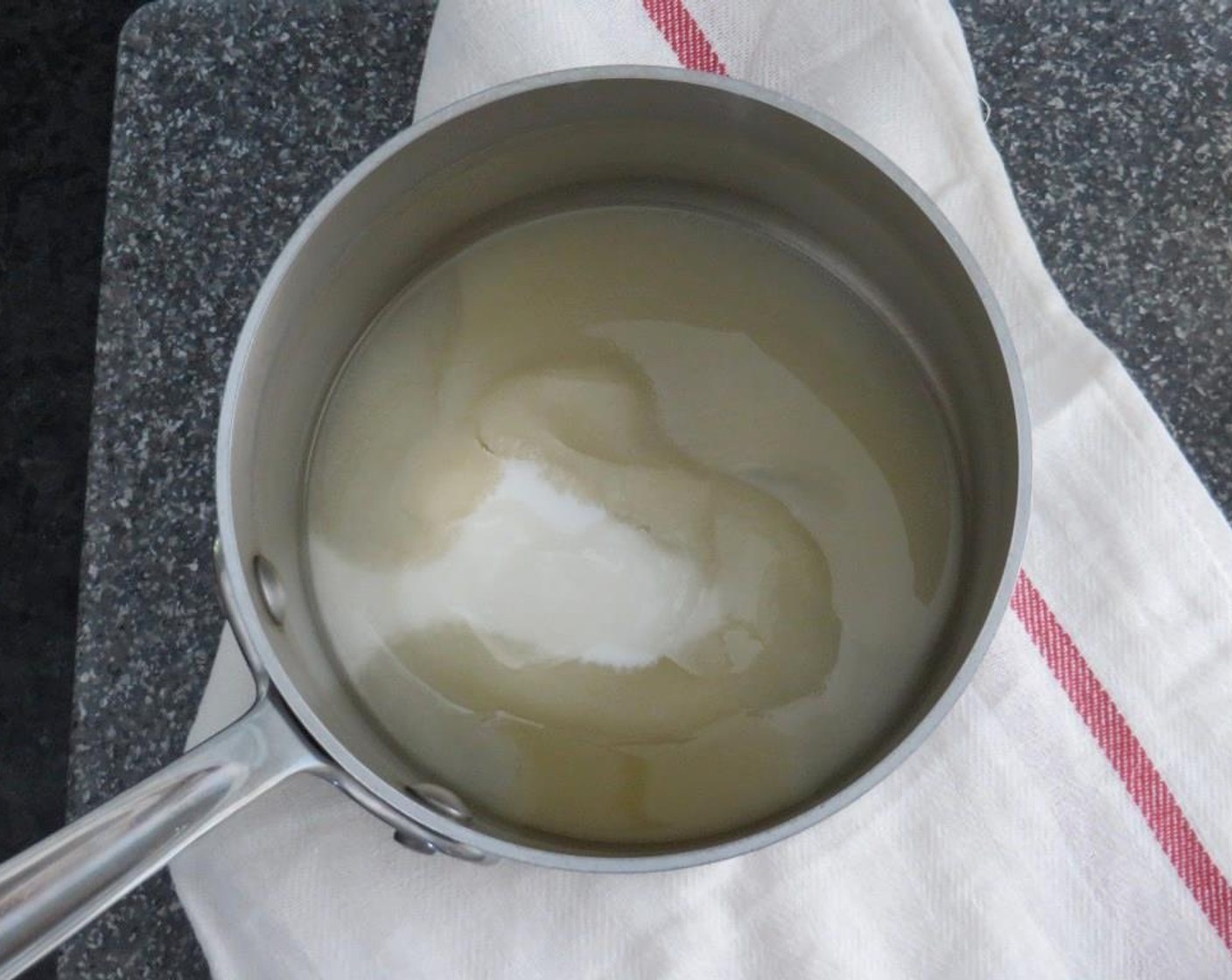 step 3 In a medium saucepan, add Granulated Sugar (1 cup), Light Corn Syrup (1 Tbsp) and Bourbon (3 Tbsp). No need to stir.