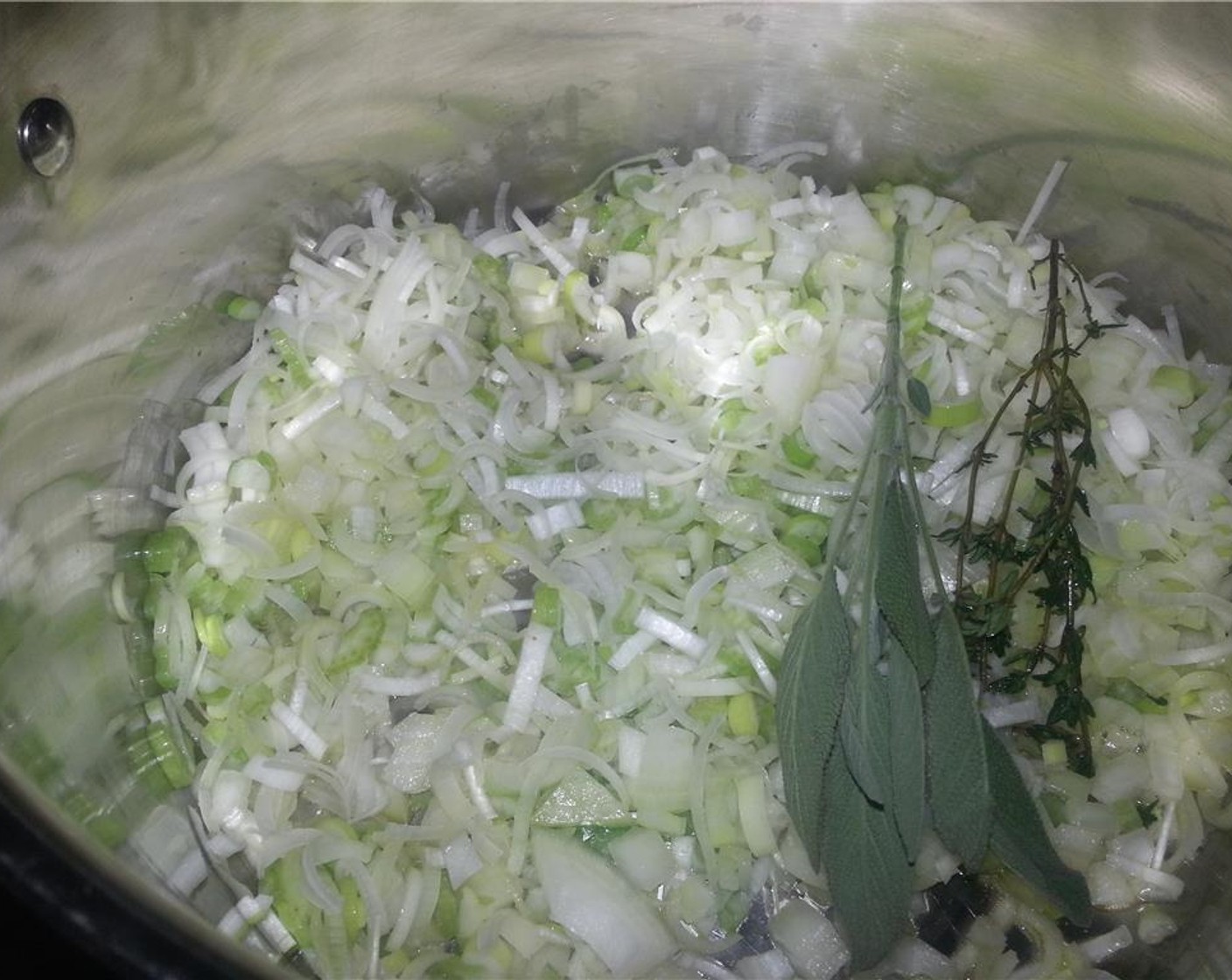 step 7 Add the leeks, celery, onion, garlic, Fresh Thyme (1 sprig), Fresh Sage (1 sprig) and a generous pinch of Salt (to taste). Cook over moderate heat, stirring occasionally, until the vegetables are soft and just starting to brown.