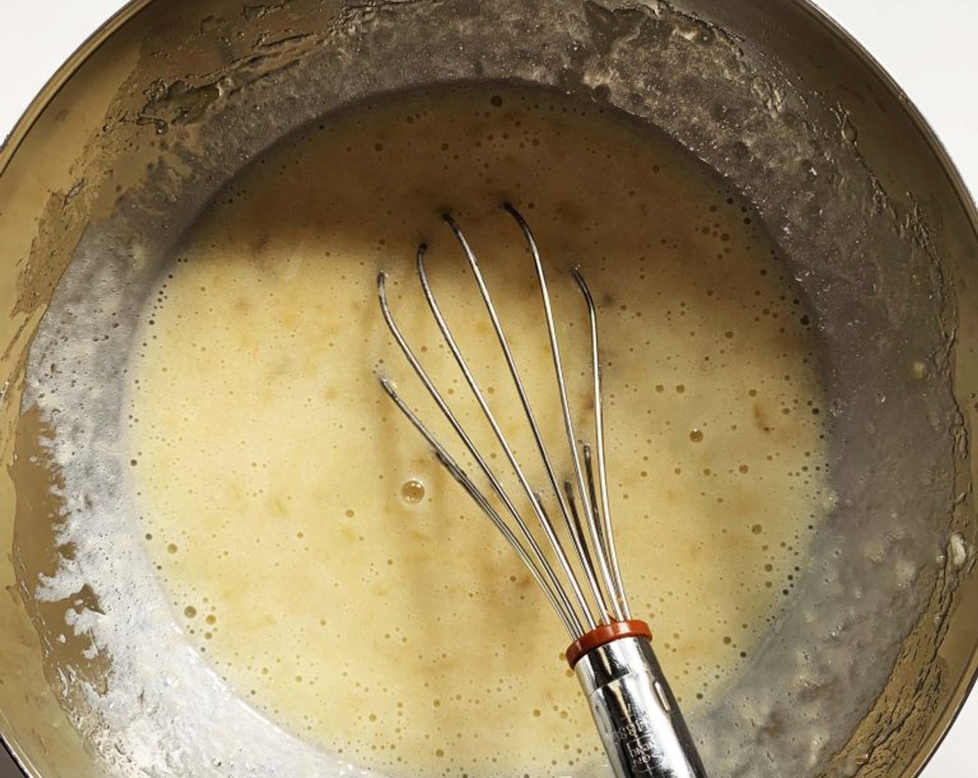 step 2 In a large bowl, mash Bananas (2 cups) with a fork. Then stir in the Organic Egg (1), Almond Milk (2 oz), and Coconut Oil (1.5 oz).