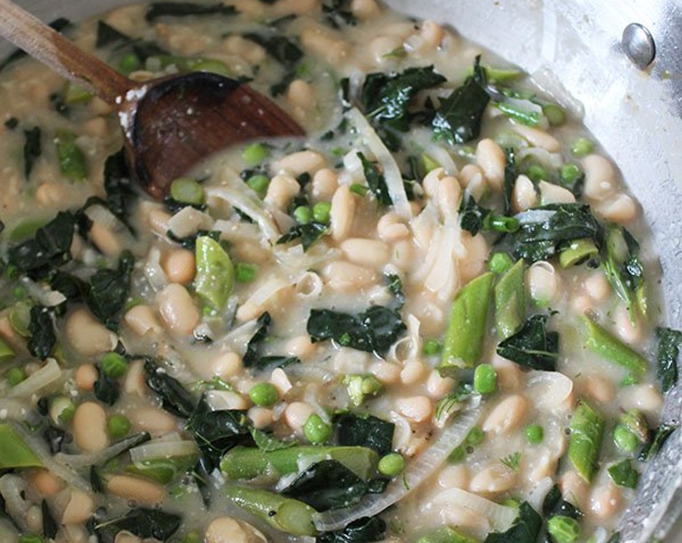 step 10 Roughly chop Kale Leaf (1 bunch), add them to the pot, and cook, tossing often, until wilted. (No need to chop if you are using spinach.) Add Frozen Green Peas (1/2 cup) and cook for 2 more minutes. If the stew is too thin at this point, simmer for a few more minutes to reduce the liquid.