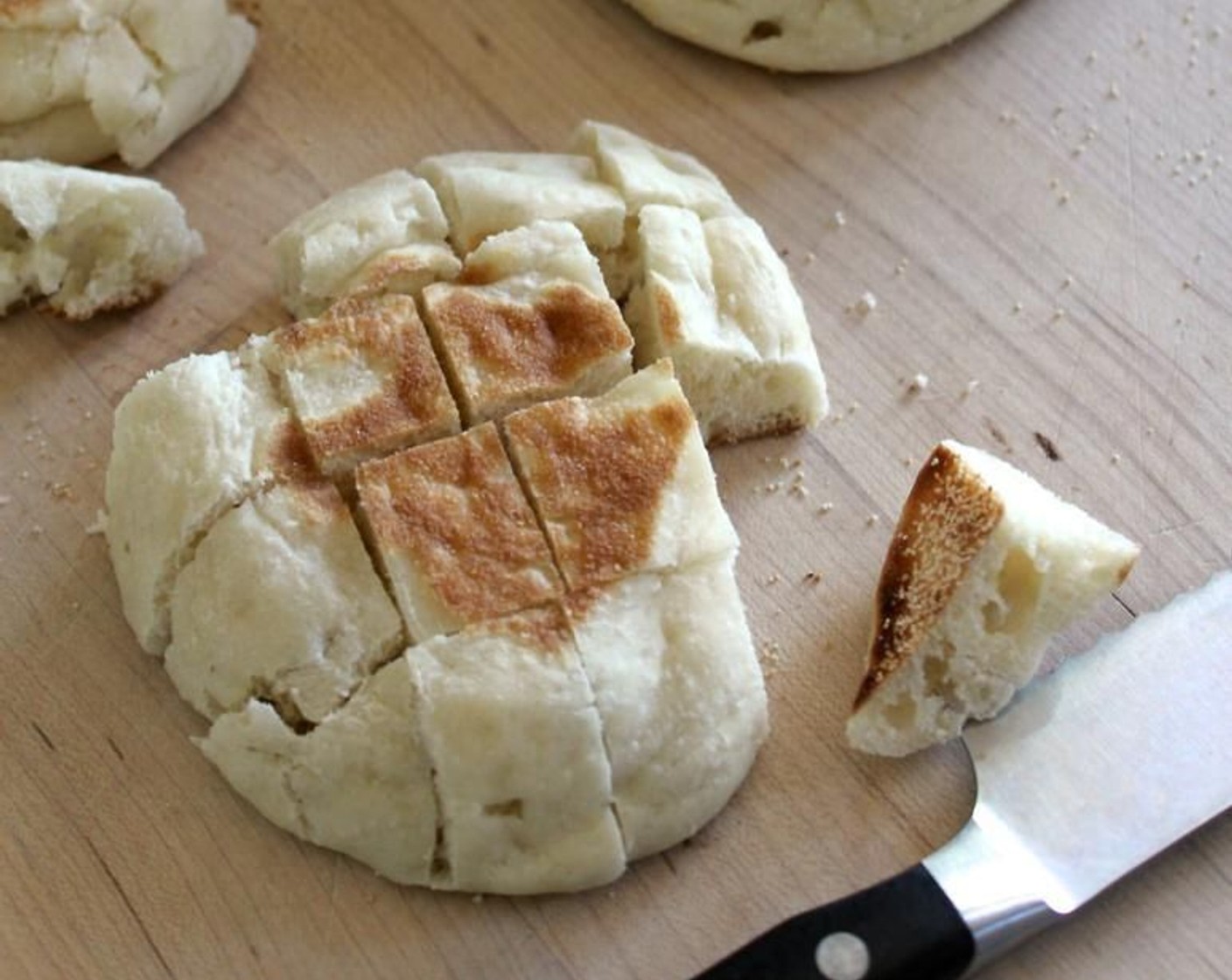 step 5 Meanwhile, cut the English Muffins (6) into 1-inch cubes (don't worry about cutting them in half them first). Spread the cubes on a sheet pan and bake, with the bacon, for 15 minutes, until lightly browned.