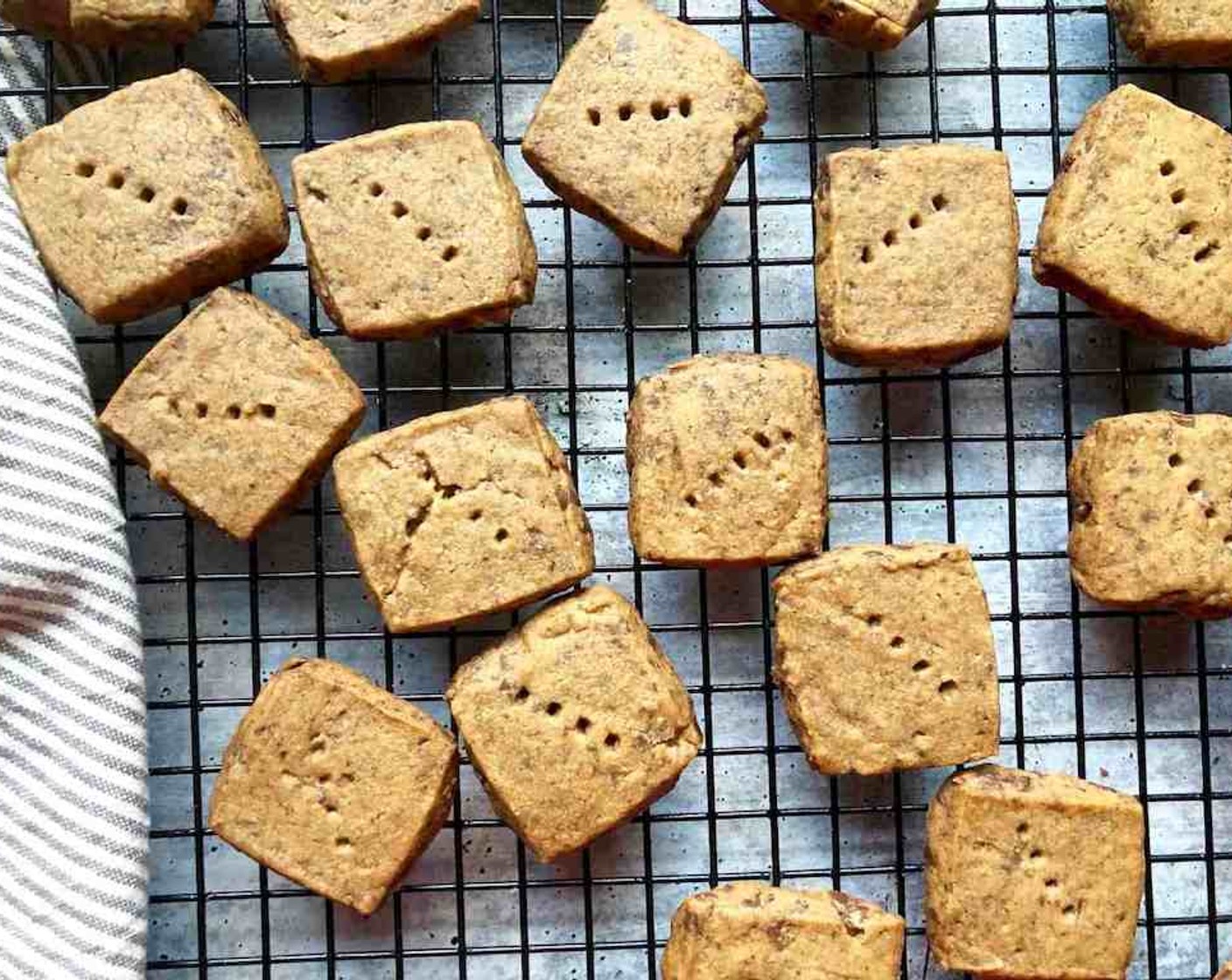 step 12 Transfer the cookies to a cooling rack. If you’d like, dust the cookies with confectioners’ sugar while they are still hot. Cool the cookies to room temperature before serving.