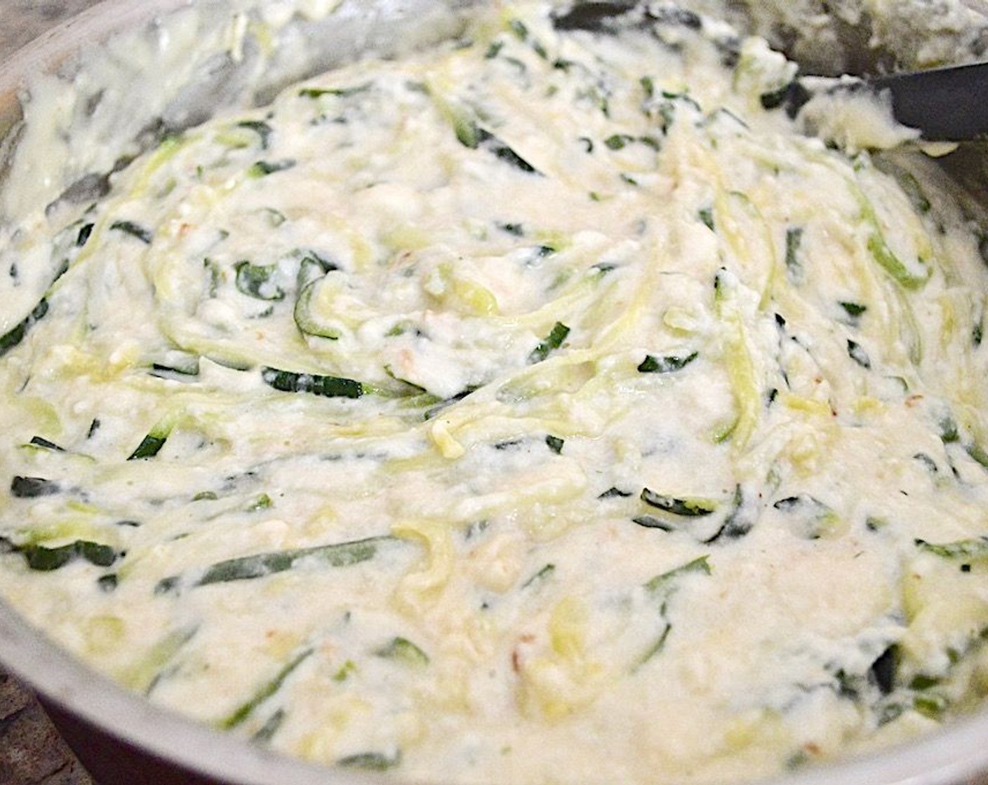 step 5 Drain the zoodles and set them aside. Whisk the Smoked Cheddar Cheese (1 3/4 cups), Dubliner Cheese (1 2/3 cups), and Parmesan Cheese (1/4 cup) into the white sauce until smooth.