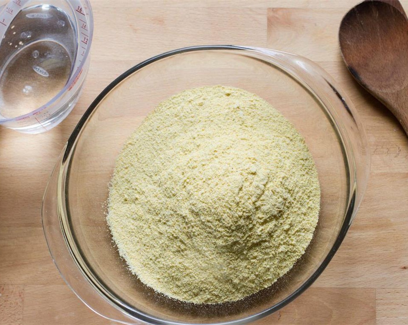 step 1 Place the Corn Masa Flour (2 cups) in a mixing bowl and dissolve the Salt (1/2 tsp) in 1 cup of hot water.
