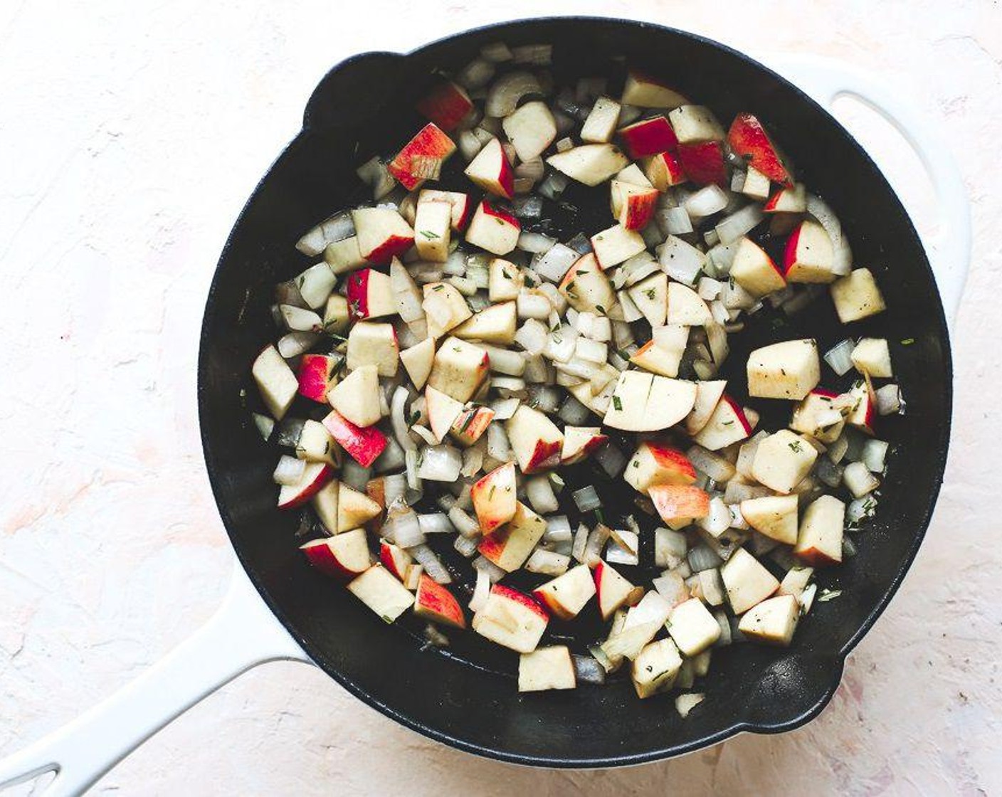 step 6 Place onions and apples in the skillet . Add the Fresh Rosemary (1 Tbsp) and Apple Cider Vinegar (1 Tbsp) and stir to combine. Return the pork chops to the skillet, and dot with Butter (3 Tbsp).