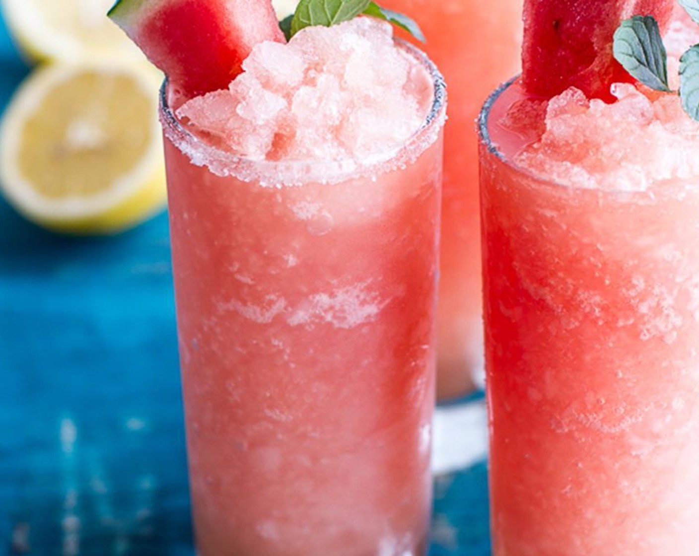 step 6 To make the slushies, Add the Ice (4 cups) and Lemonade (1 1/2 cups) to a blender and blend until nearly smooth but slightly chunky. Add the Fresh Mint Leaves (1 Tbsp) or basil if using, taste and add more lemonade if desired.