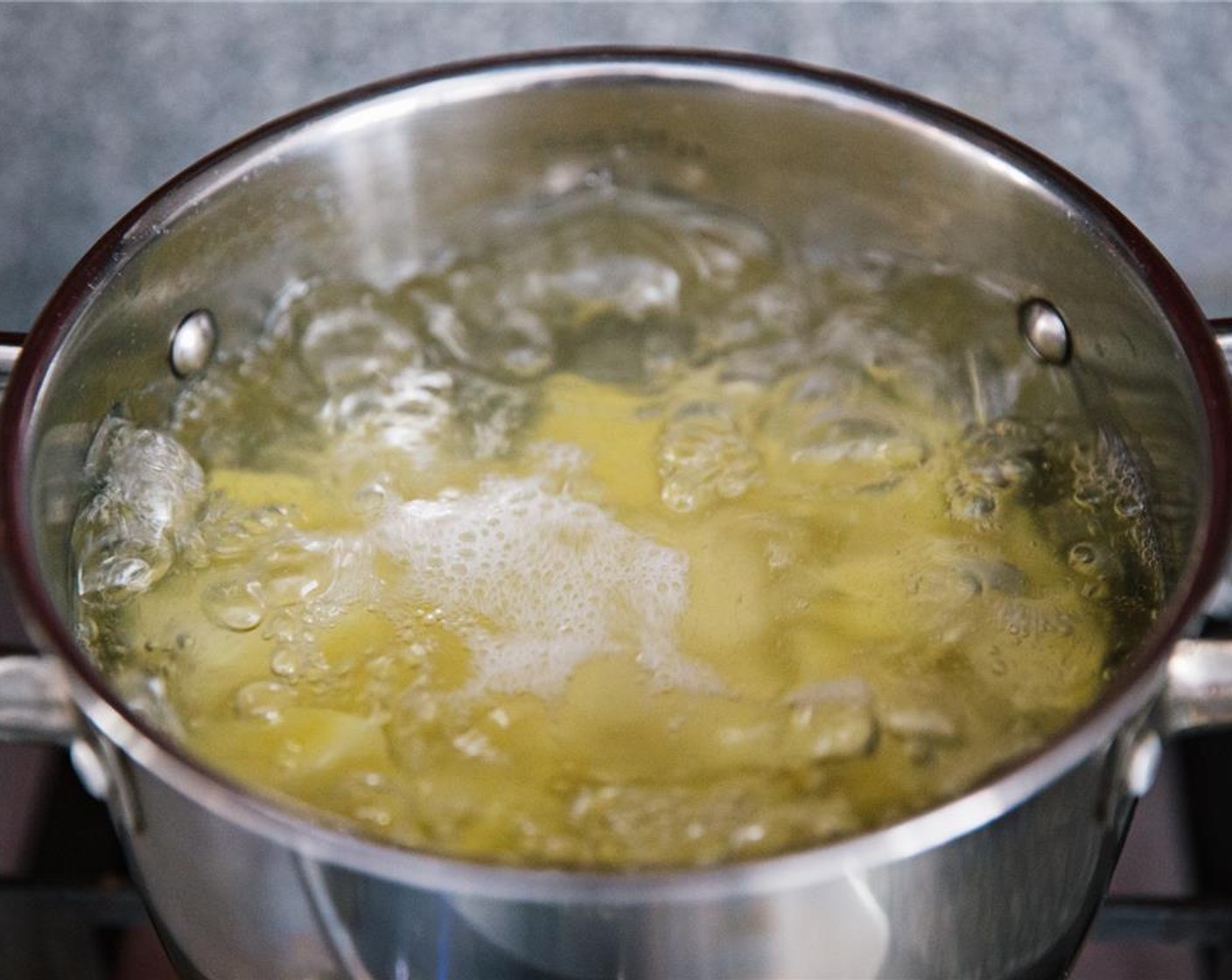 step 2 Drain potatoes and place in a large pot. Cover by about 3 inches with cold water. Add a generous sprinkle of salt. Bring to the boil and cook until potatoes are tender when poked with a fork, about 45 minutes.