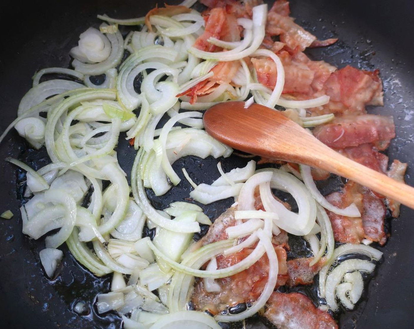 step 1 Render Smoked Bacon (4 slices) over medium heat, add Onion (1), and saute until onions are lightly caramelized.