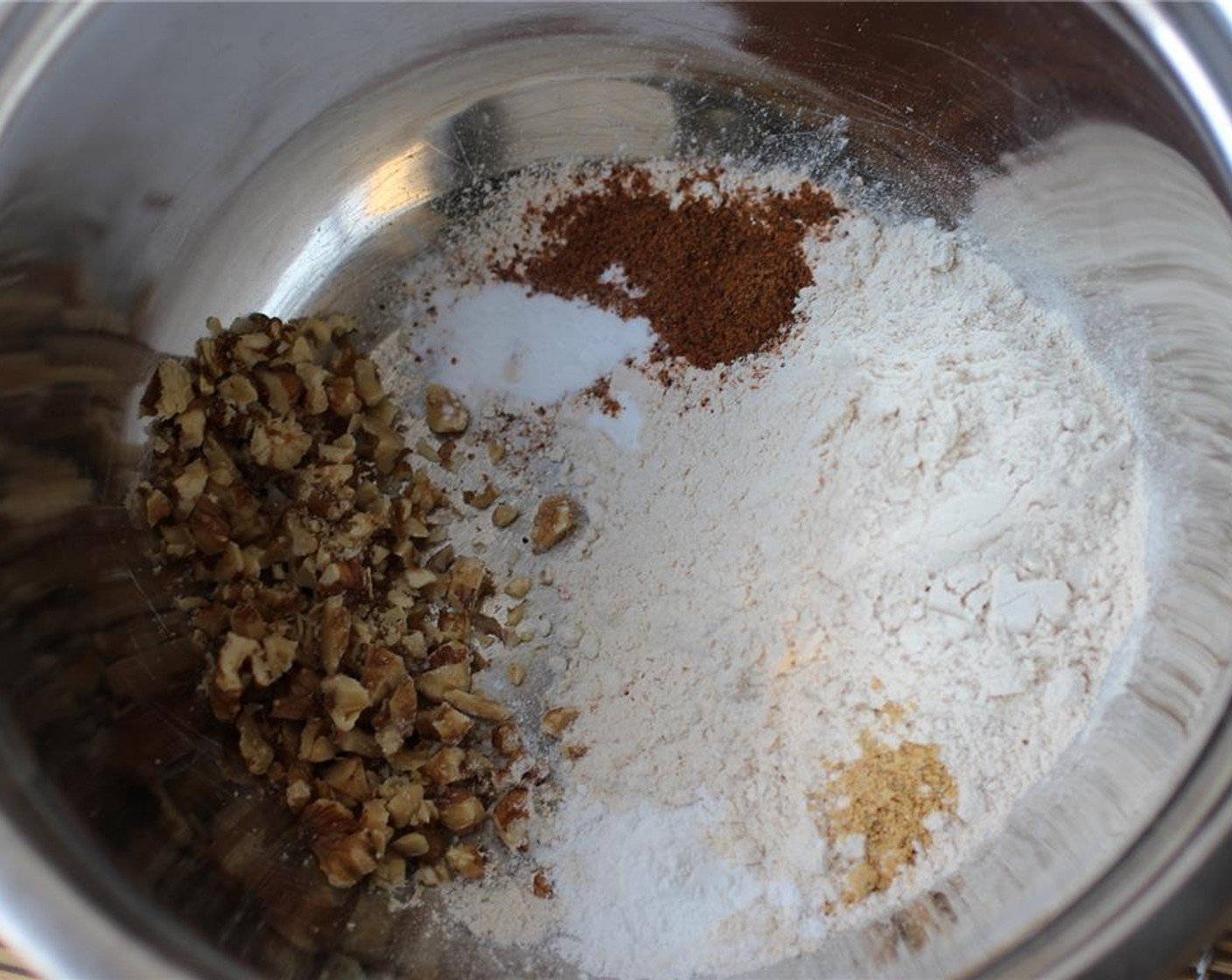 step 2 For the dry ingredients, add the Whole Wheat Pastry Flour (1 cup), Baking Powder (1 tsp), Baking Soda (1/2 tsp), Salt (1 pinch), Ground Nutmeg (1 tsp), Ground Ginger (1/8 tsp), and Walnut (1/4 cup) and mix together.