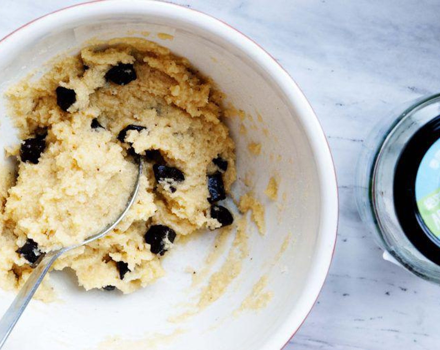 step 3 Add in the Almond Flour (2/3 cup), Granulated Erythritol (2 Tbsp), Vanilla Extract (1 tsp), Baking Soda (1/2 tsp), Baking Powder (1/4 tsp), Salt (1 pinch), and Sugar-Free Chocolate (1/2 cup) and mix until a cookie dough forms.