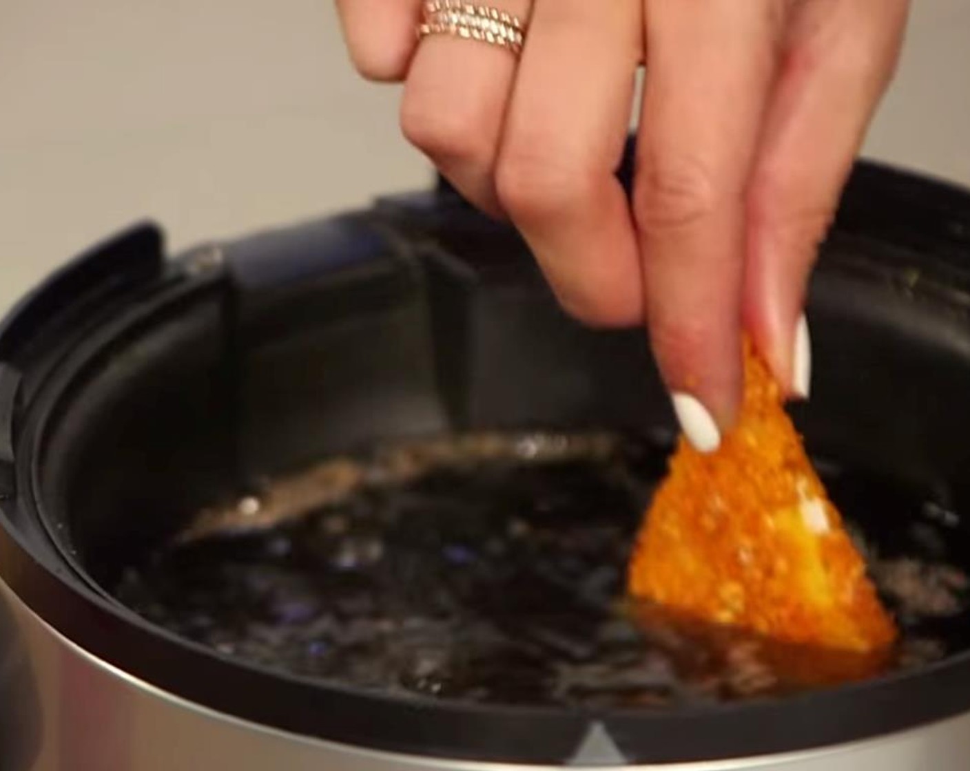 step 6 When ready to serve, heat Vegetable Oil (as needed) in a heavy-bottomed Dutch oven or electric deep fryer to 350 degrees F (180 degrees C). Working in batches, fry the cheese-stuffed Doritos for 1 to 2 minutes, or until the outside is crisp and golden brown.