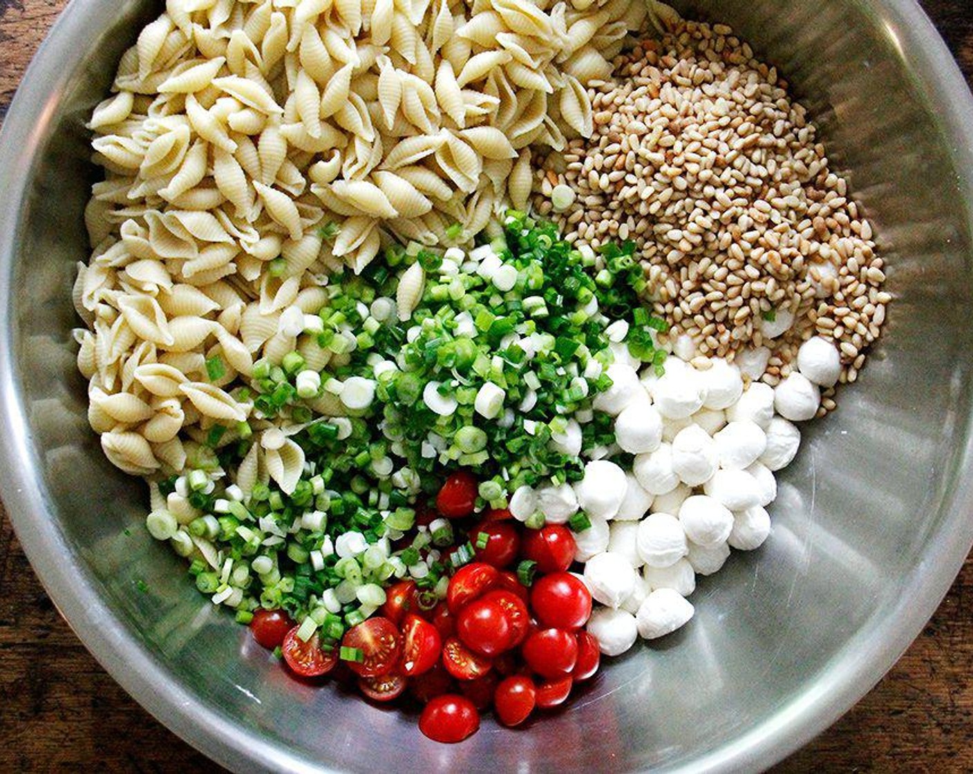 step 5 Add all of the prepared ingredients. Remove tiny leaves from Fresh Basil (1 bunch) stems and add directly to the bowl. Stack four to five larger basil leaves on top of one another. Roll into a tight spiral, then cut into thin strips. Add to the bowl.