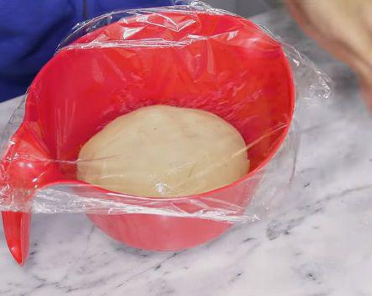 step 4 Grease the bowl with Oil (as needed) and add dough, brush the top of the dough and cover with plastic wrap and a kitchen towel and let it rise for 1:30 to 2 hours.
