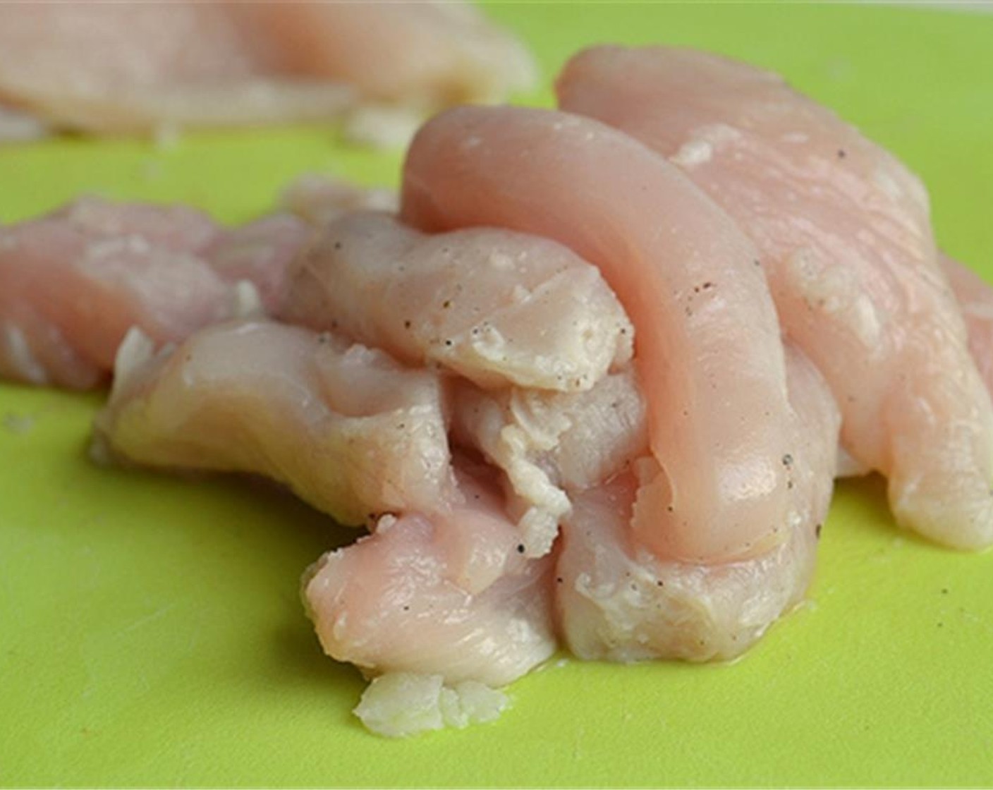 step 1 Cut the Chicken Breasts (2) into strips.