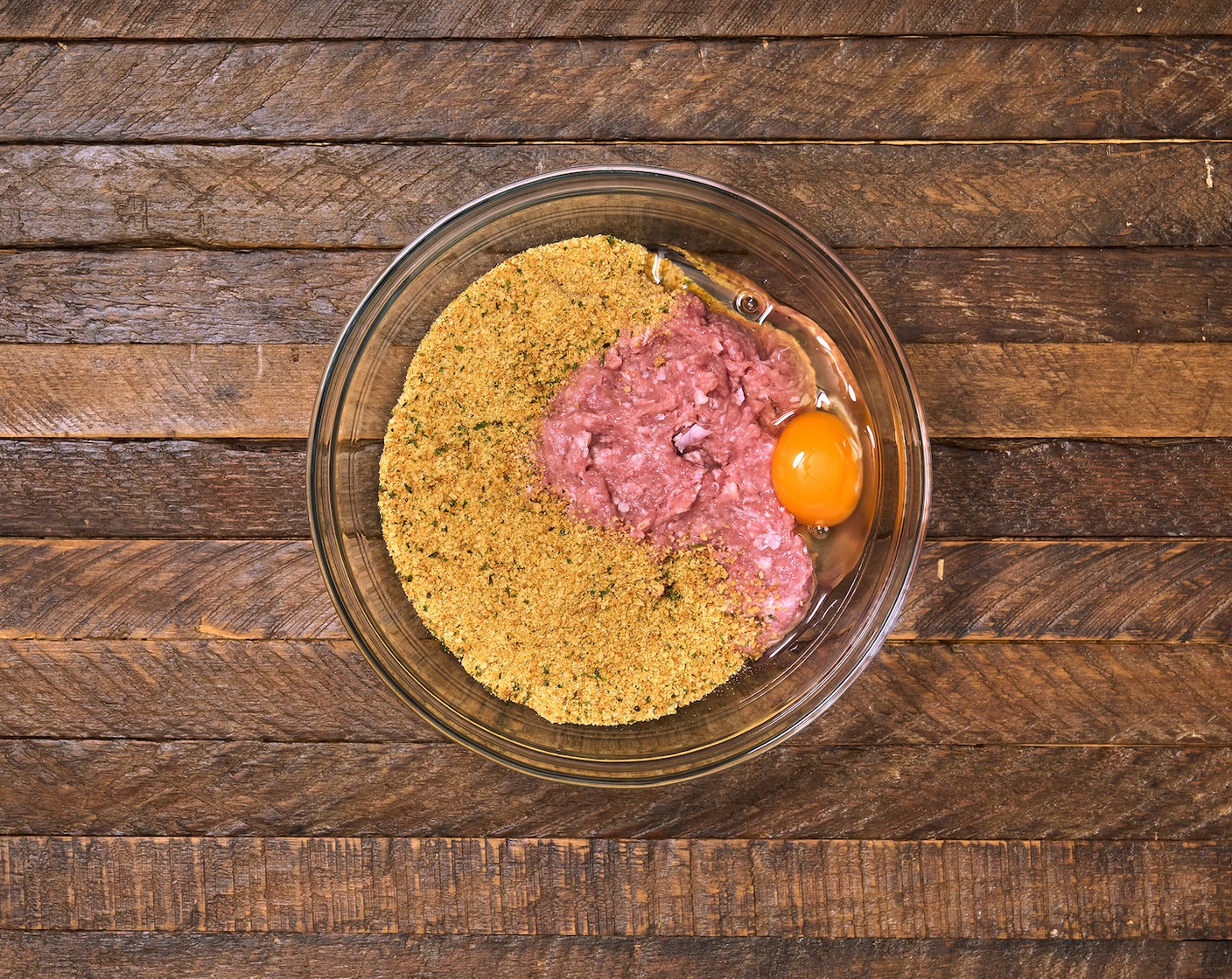 step 2 In a large mixing bowl, add Ground Turkey (1 lb), Italian-Style Breadcrumbs (1/2 cup), Egg (1), McCormick® Garlic Powder (1/2 tsp), Onion Powder (1/2 tsp), Salt (1 tsp), and Ground Black Pepper (to taste). Mix well using gloved hands or a spoon and form into 1-inch-sized meatballs.