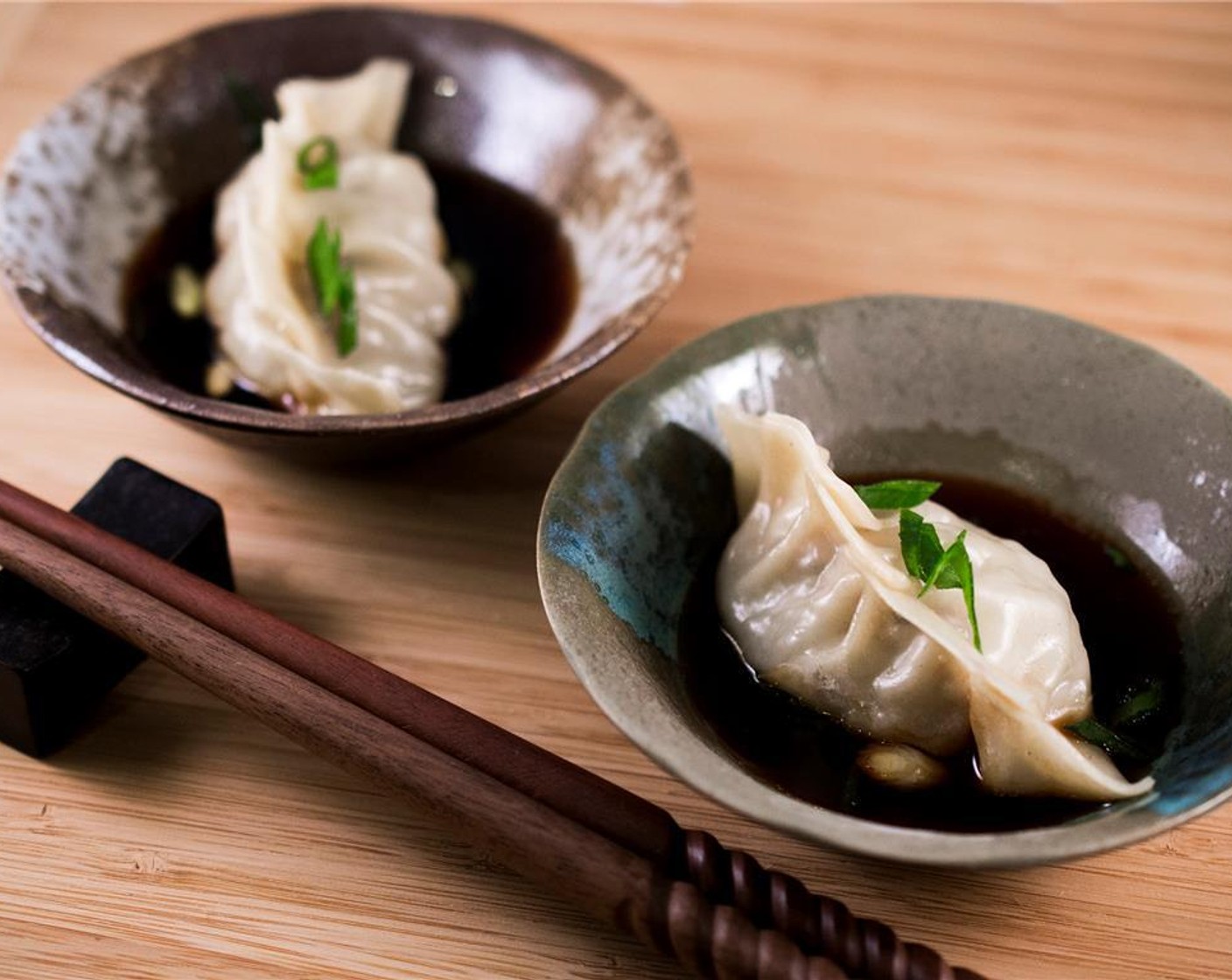 step 9 Fill a wok or similar frying pan, with 2 inches of water and bring to a boil. Gently set the bamboo steamer directly into the wok and let steam for 10 minutes. Serve with dipping sauce.