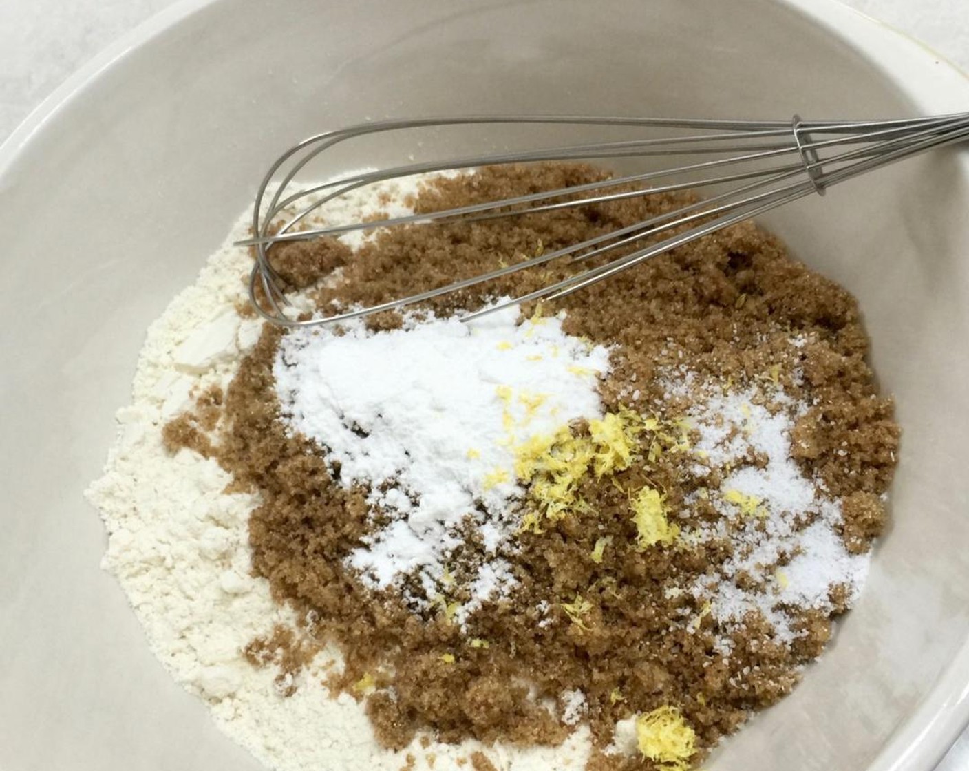 step 5 In a large bowl, add in the dry ingredients: All-Purpose Flour (3 cups), Brown Sugar (1 cup), Baking Powder (2 tsp),Salt (1/2 tsp) and Lemon Zest.
