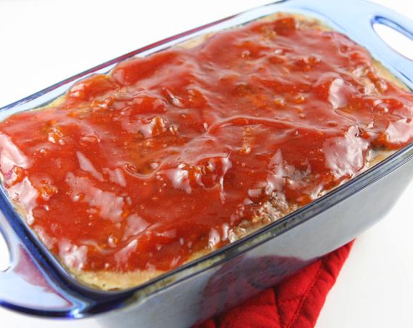 step 5 Spread half of the mixture evenly over the meatloaf halfway through baking.