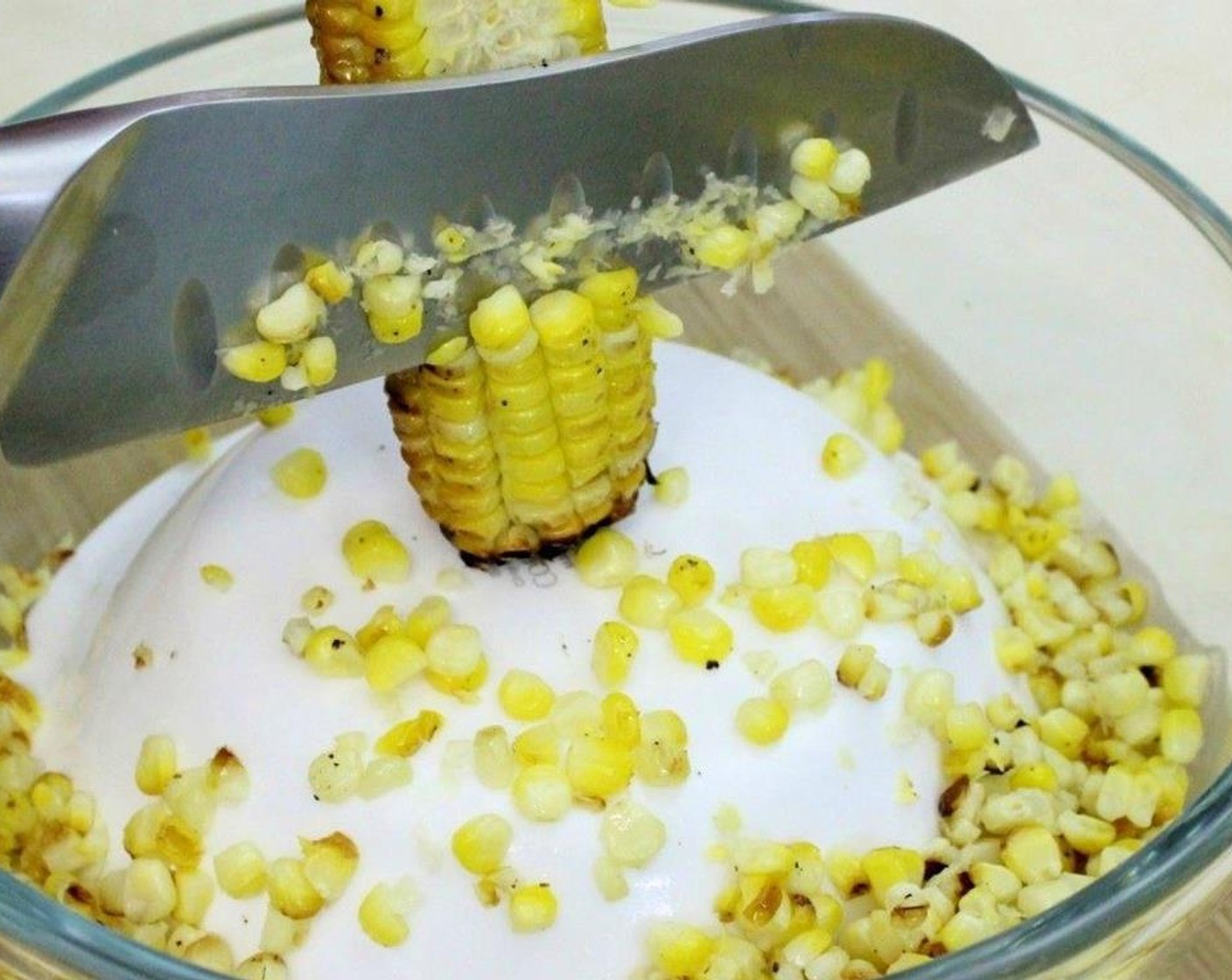 step 6 Strip the kernels of the corn once they are cool. A trick that I found works great is to set a small bowl upside down into a large bowl, place the corn on top of the small bowl and strip.