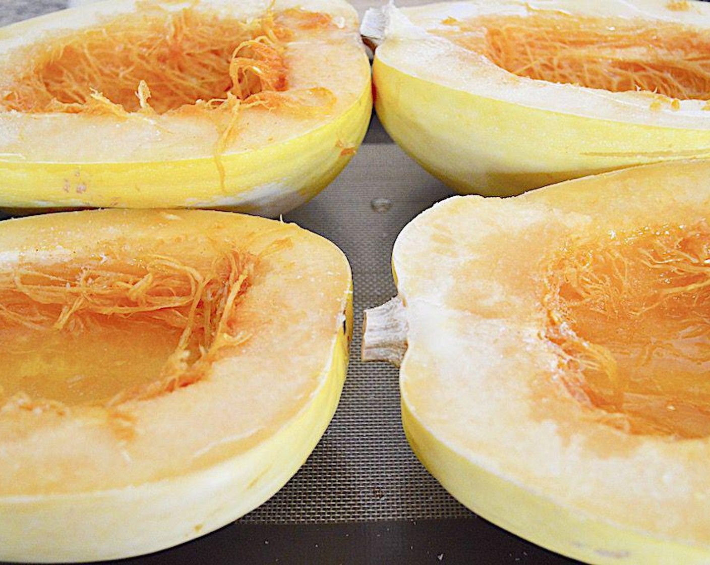 step 2 Cut the spaghetti squash in half lengthwise and scrape out all of the seeds from each half. Lay them out on the sheet tray and drizzle each of them generously with Olive Oil (as needed). Then sprinkle them all generously with the Salt (to taste) and McCormick® Garlic Powder (to taste). Get them into the oven for 45-50 minutes, until completely tender.