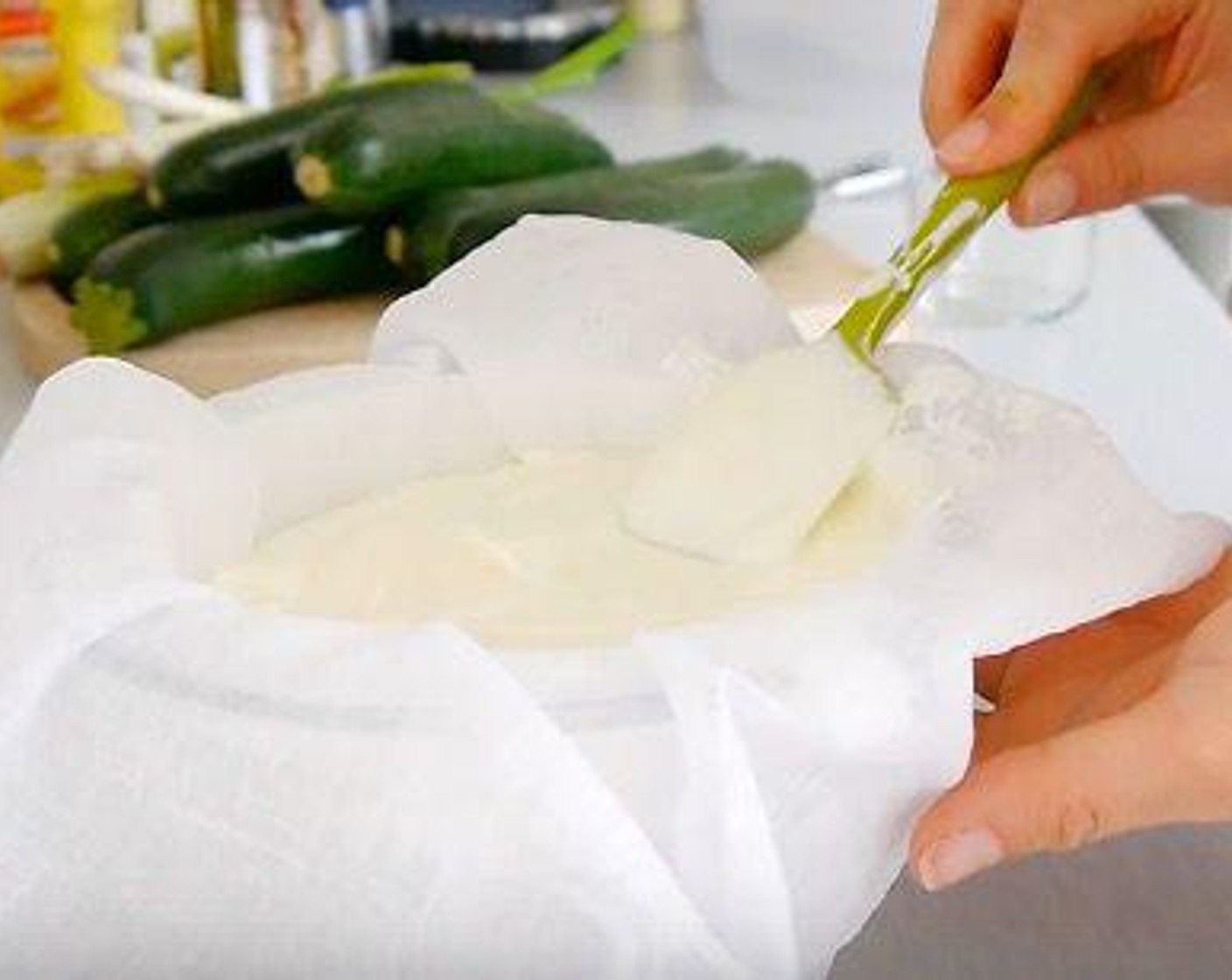 step 2 Pour the yogurt onto a muslin cloth that has been previously placed over a colander or sieve and over a bowl.