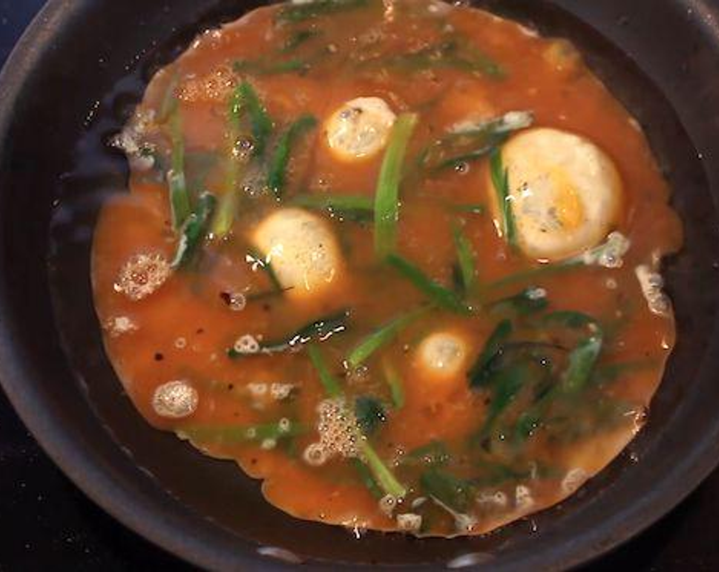 step 3 Heat the Vegetable Oil (3 2/3 Tbsp) into the pan or wok over a high heat. When the pan/wok is hot add the egg and garlic chive mixture into the pan/wok. The egg mixture will get fluffy around the edges. Mix the centre of the egg mixture and gently fold.