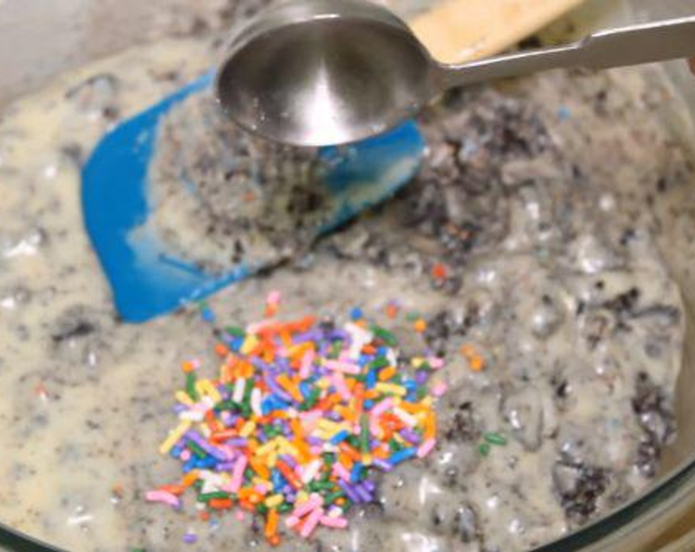 step 3 To the melted chocolate, add Vanilla Extract (1 tsp) and whisk gently. Add the crushed Oreo and fold everything together. Add the Sprinkles (3 Tbsp) and fold them in.