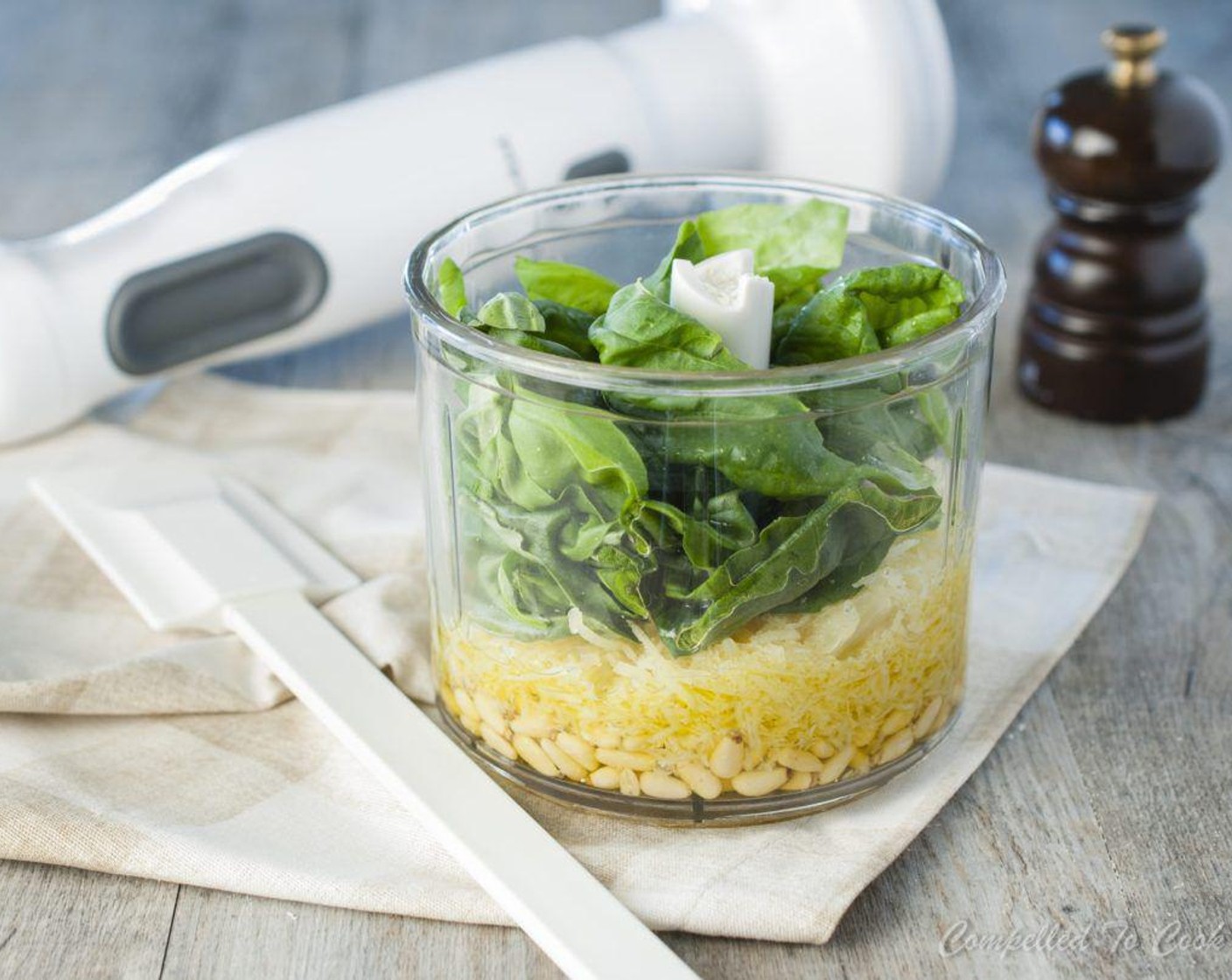 step 1 Add Fresh Basil Leaves (2 1/2 cups), Parmesan Cheese (2/3 cup), Romano Cheese (2 Tbsp), Olive Oil (1/2 cup), Pine Nuts (1/4 cup), Garlic (2 cloves), Salt (1/2 tsp), and the juice from Lemon (1) to a food processor and puree until blended but still has some texture, about 20 to 30 seconds.