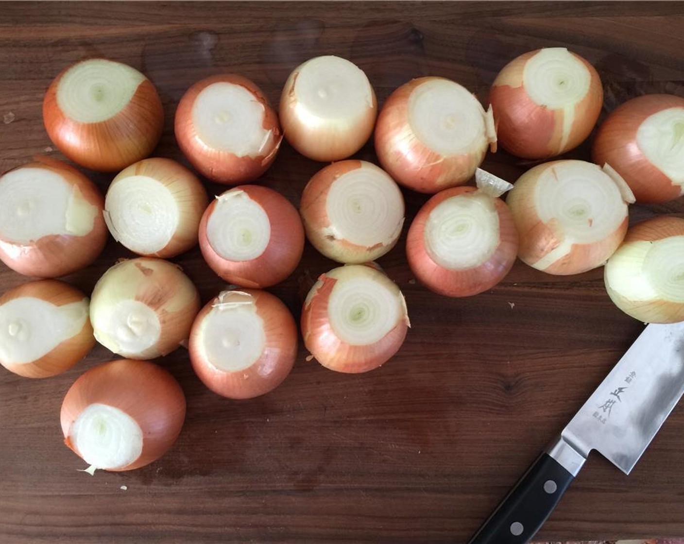 step 1 Get ready to cry for a bit folks. Start by slicing the tops and bottoms from each of the Yellow Onions (14 cups).