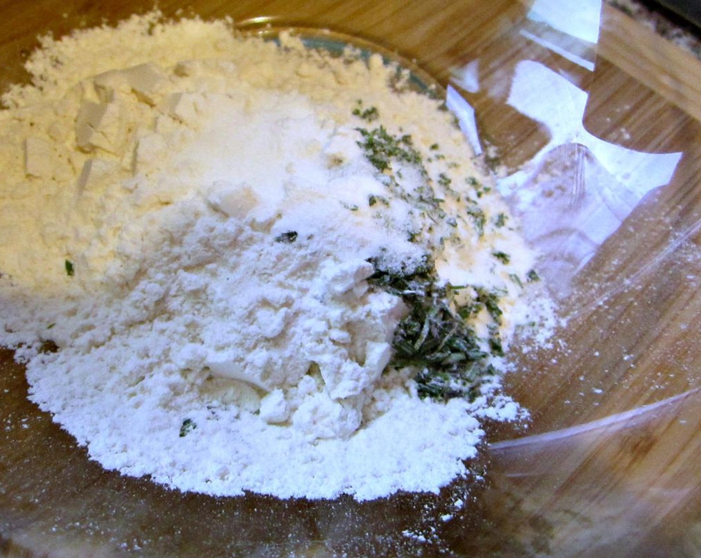step 4 Stir together the All-Purpose Flour (1 2/3 cups), Fresh Rosemary (1 Tbsp), Baking Powder (1/2 tsp), Sea Salt Flakes (1 pinch), and Ground Black Pepper (1/2 tsp) in a medium bowl.