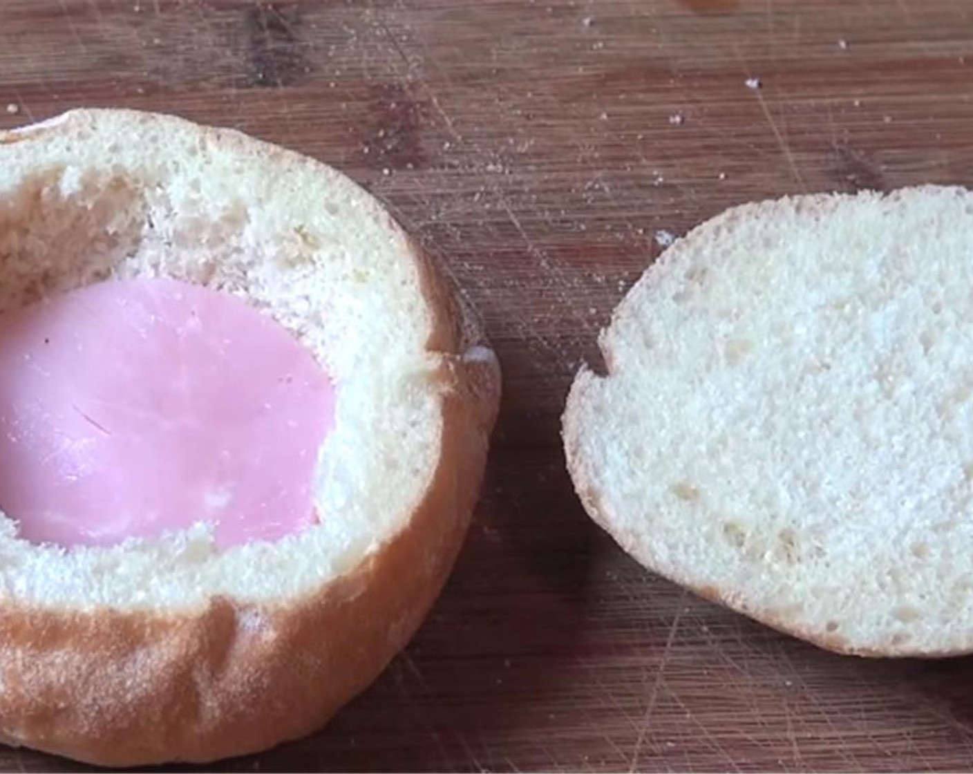 step 2 Cut the Ham (1 slice) to size and press it in so it covers the bottom of the bread roll.