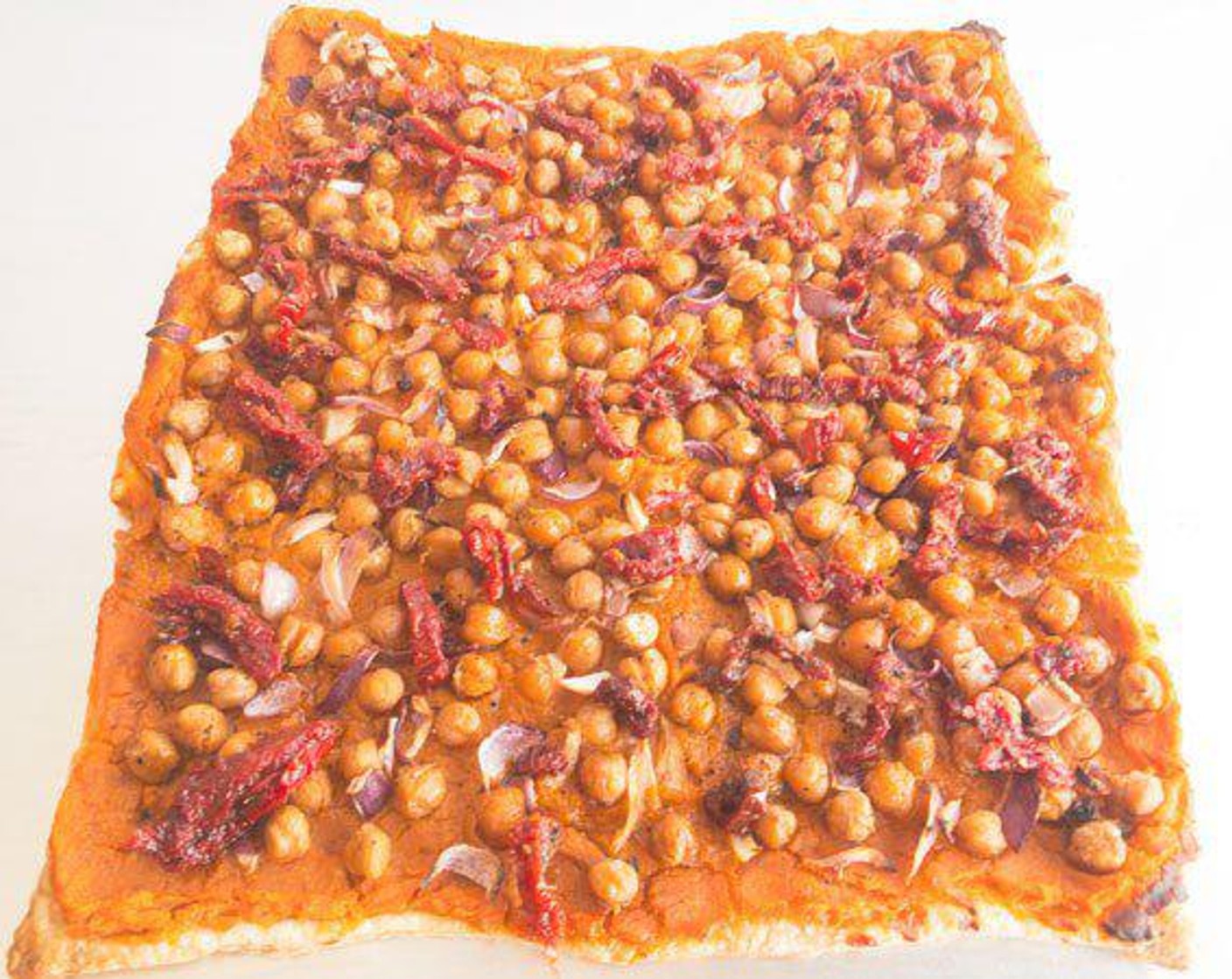 step 7 Spread sweet potato mixture to all edges and evenly spread the chickpeas. Add the Red Onion (1/2 cup) now if you prefer it cooked, but I recommend adding it after baking for more flavor. Do not add the sun-dried tomatoes before baking or they will burn!