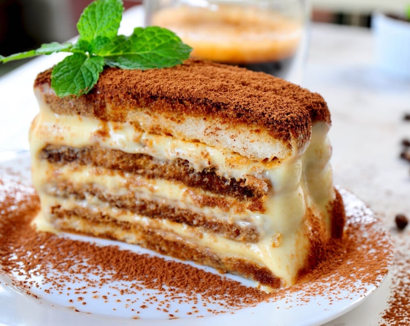 step 15 Sieve Unsweetened Cocoa Powder (2 Tbsp) over the top of tiramisu and it's ready to be served. Cut into smaller slices before serving. Enjoy!